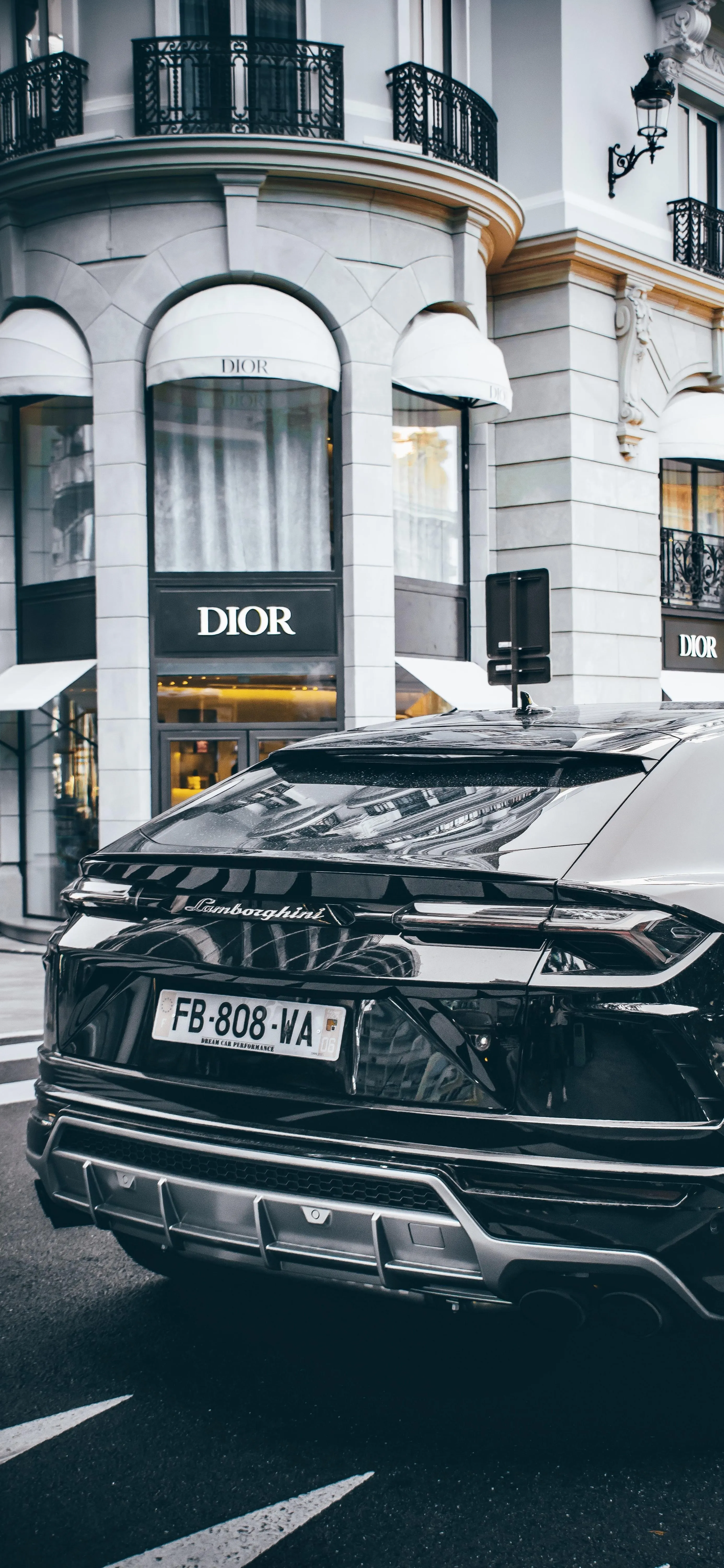 Classic Car Parked in Urban Setting with Elegant Architecture