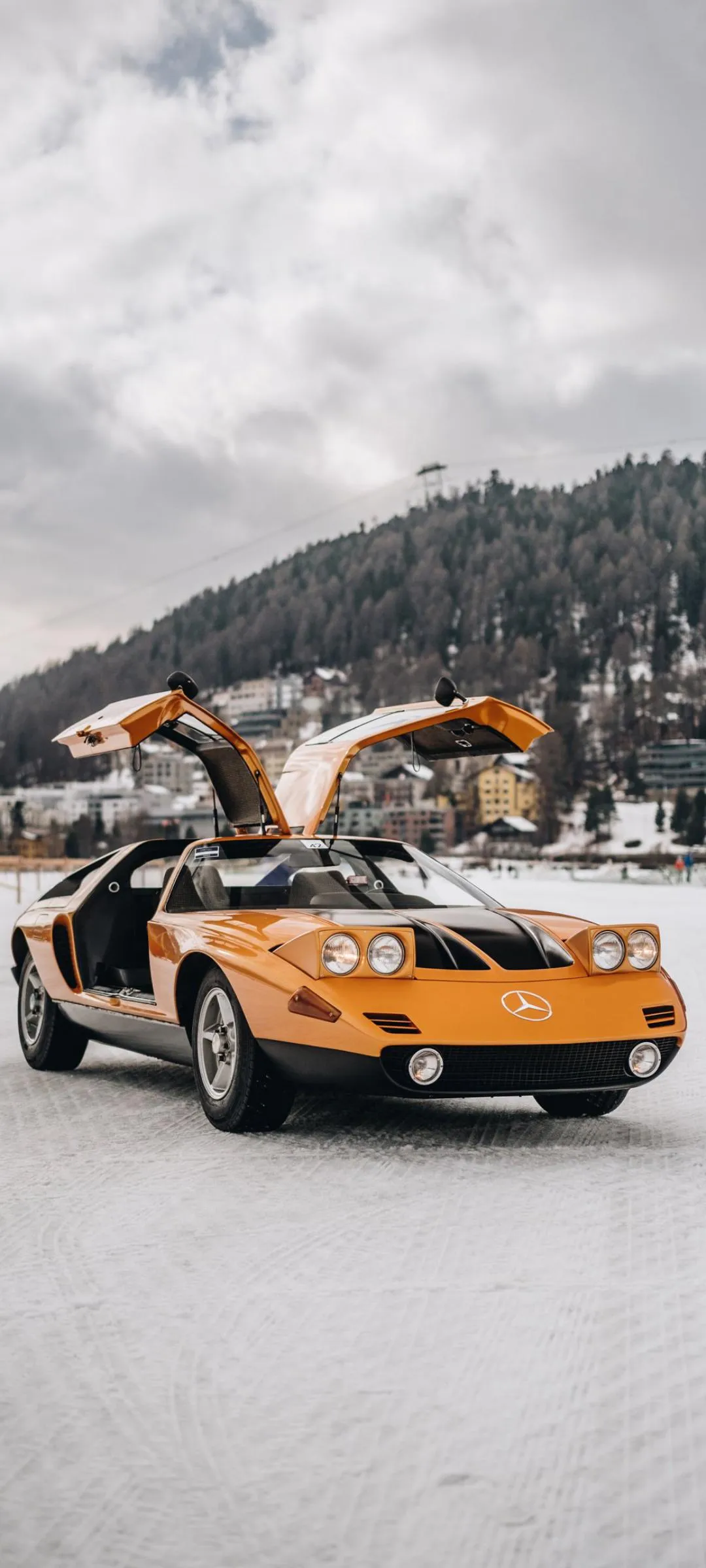Classic Car Parked on Snowy Mountain Adventure Road
