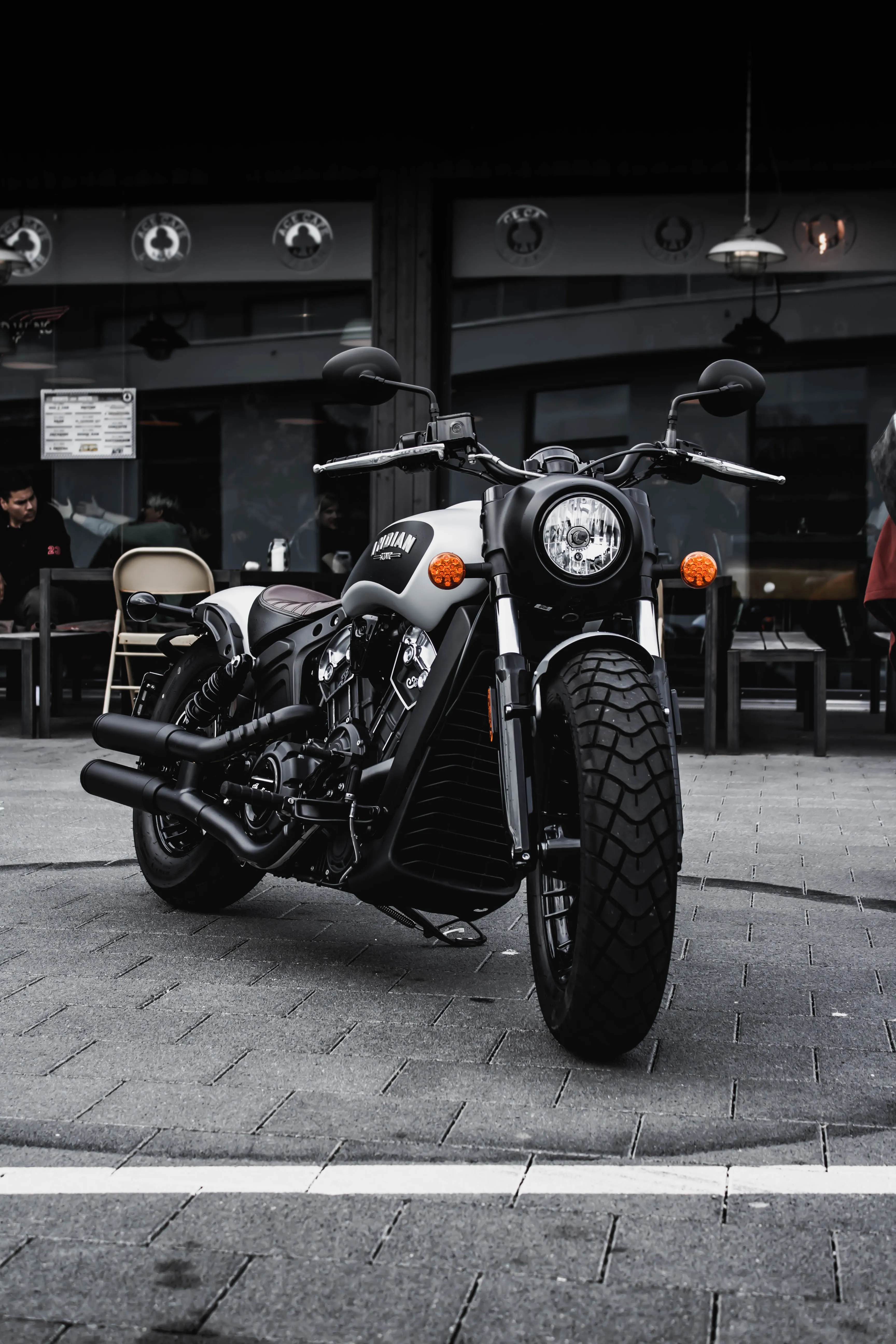 Classic Motorcycle Parked Inside a Garage Space Wallpaper