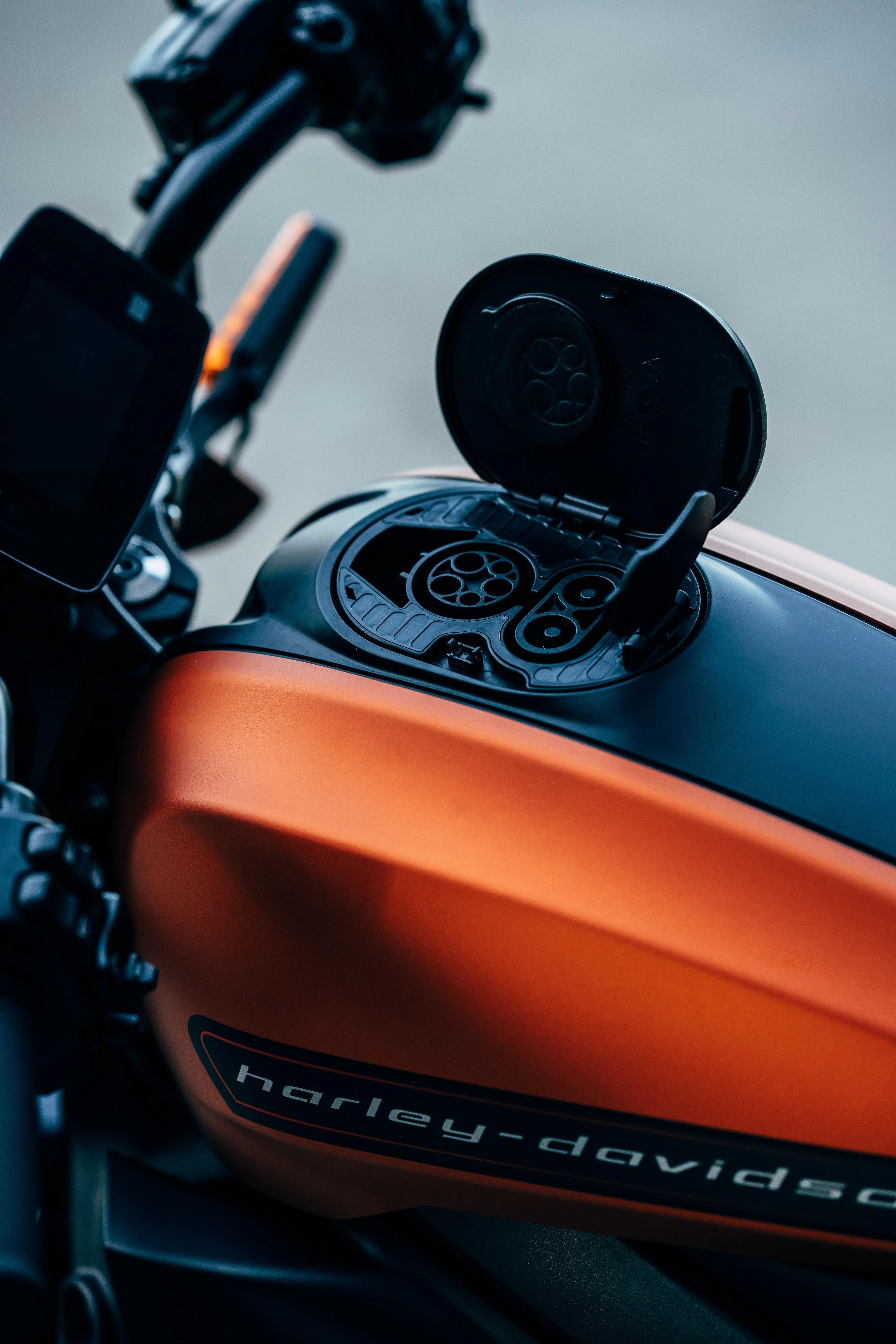 Classic Orange Motorcycle Handlebar Close Up Shot Image