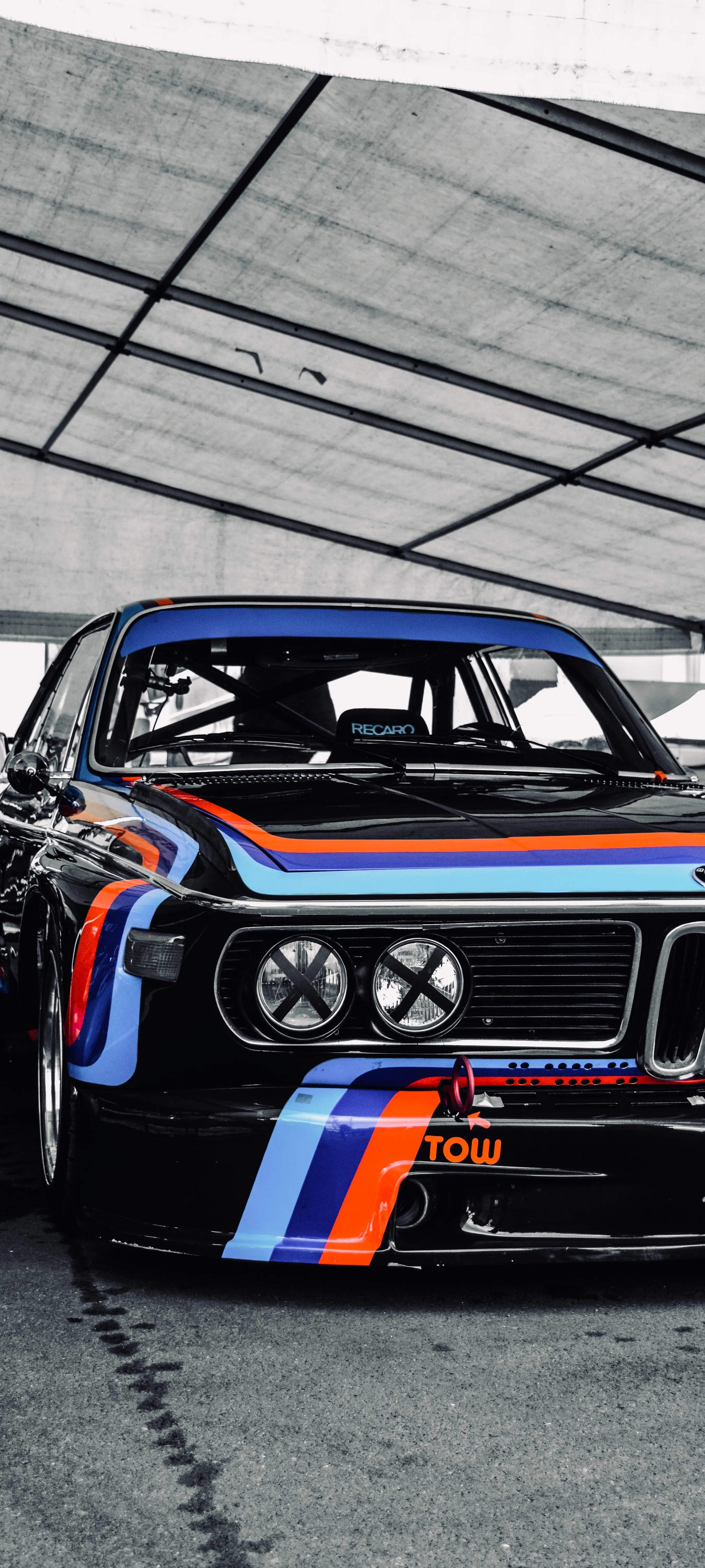 Classic Race Car in White Garage Interior Wallpaper HD