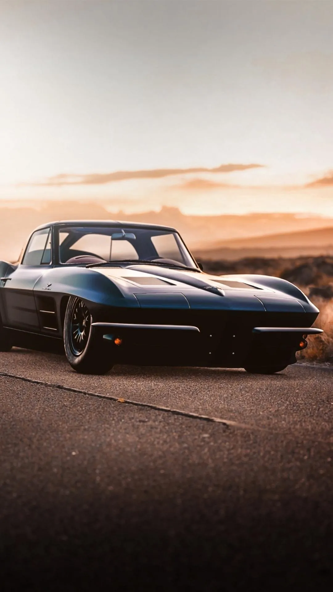 Classic Sports Car in Warm Golden Sunset Lighting Wallpaper