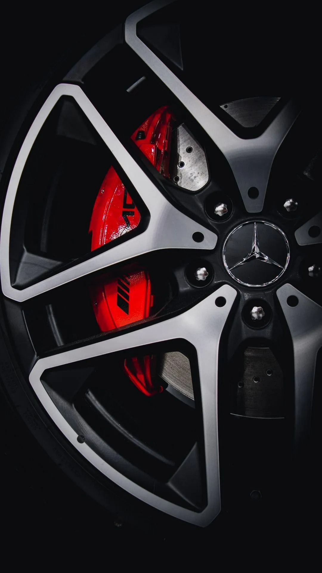 Close Up of Black Alloy Wheel with Red Sport Detail