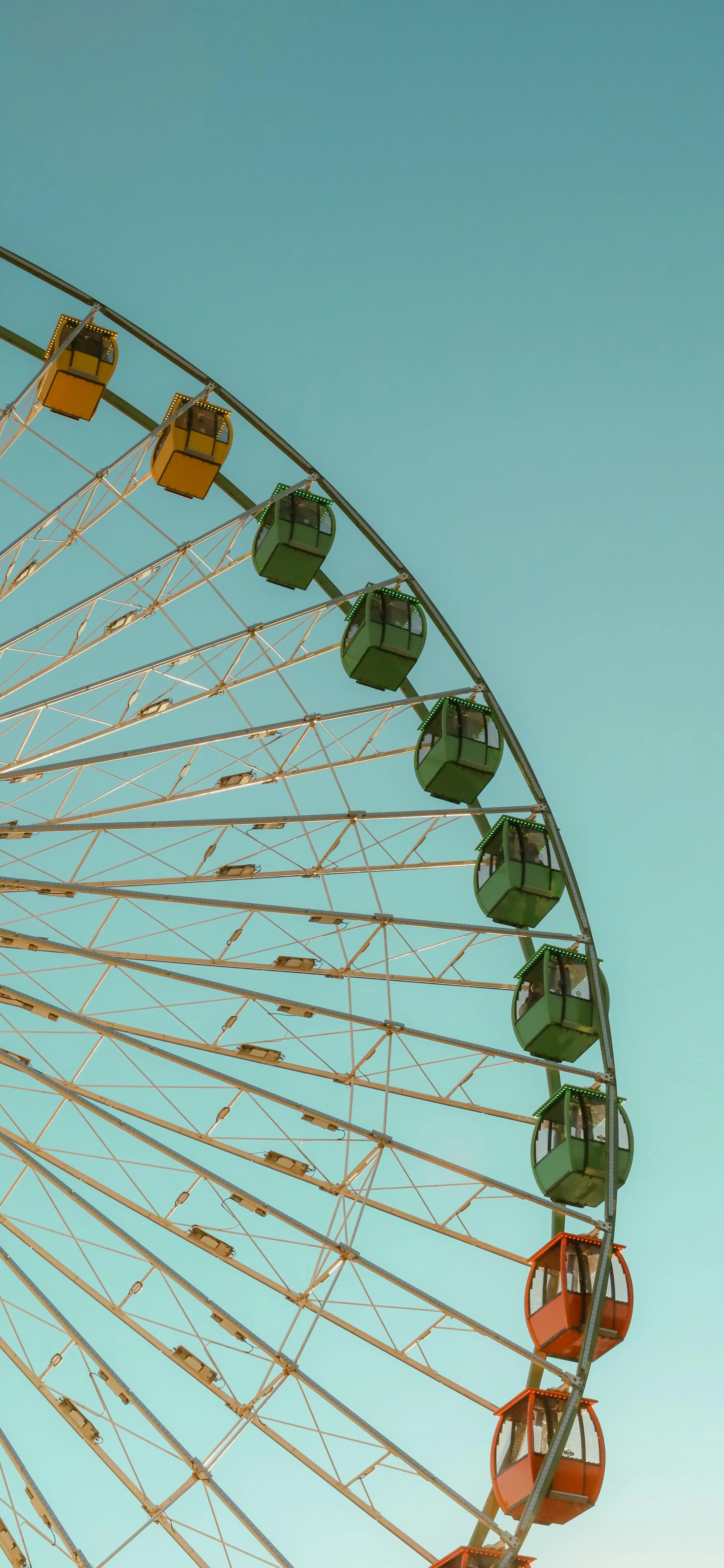 Close Up of Giant Ferris Wheel Against Clear Sky Background