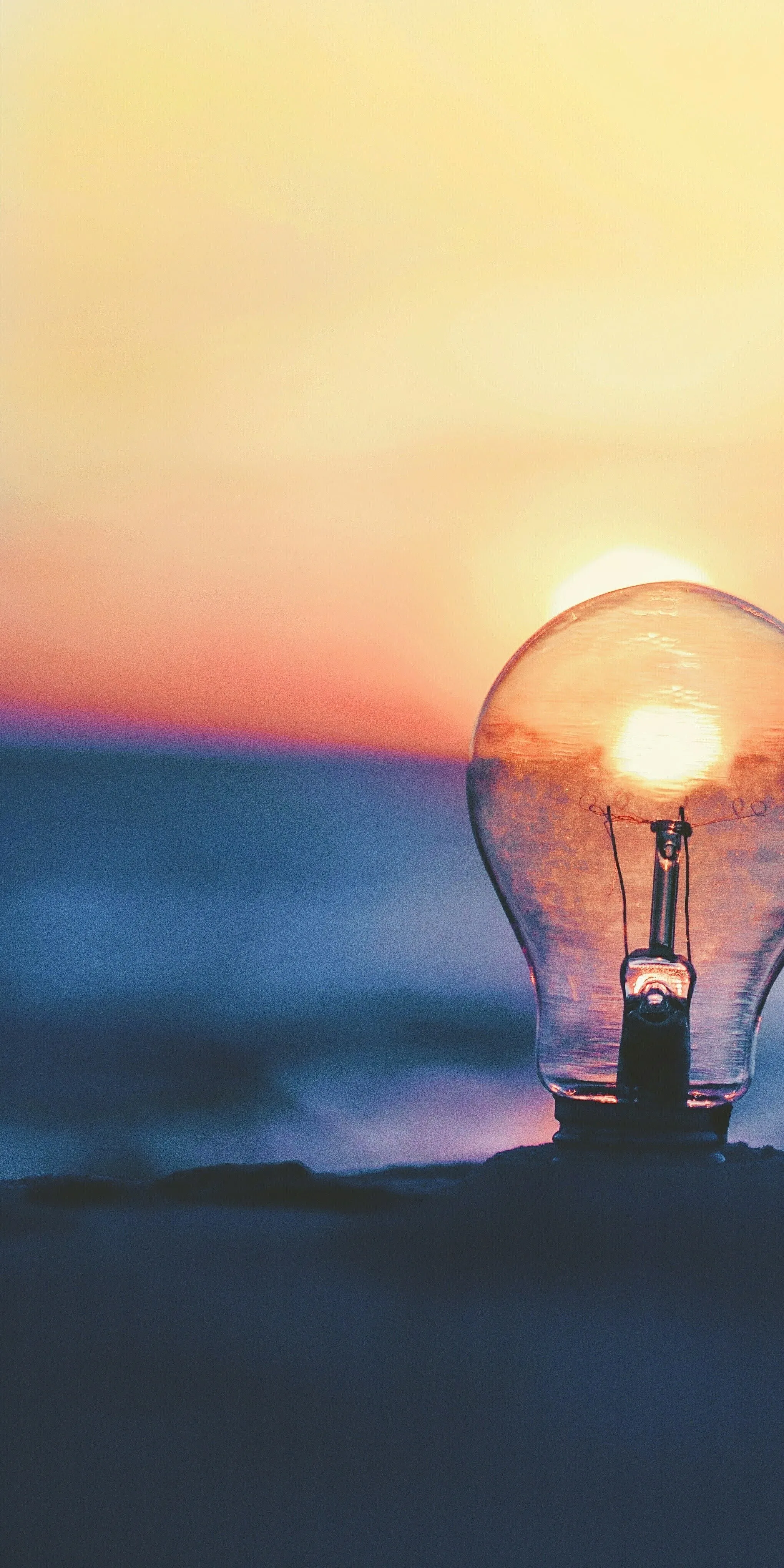 Close Up of Lightbulb with Soft Warm Light and Blurred Backdrop