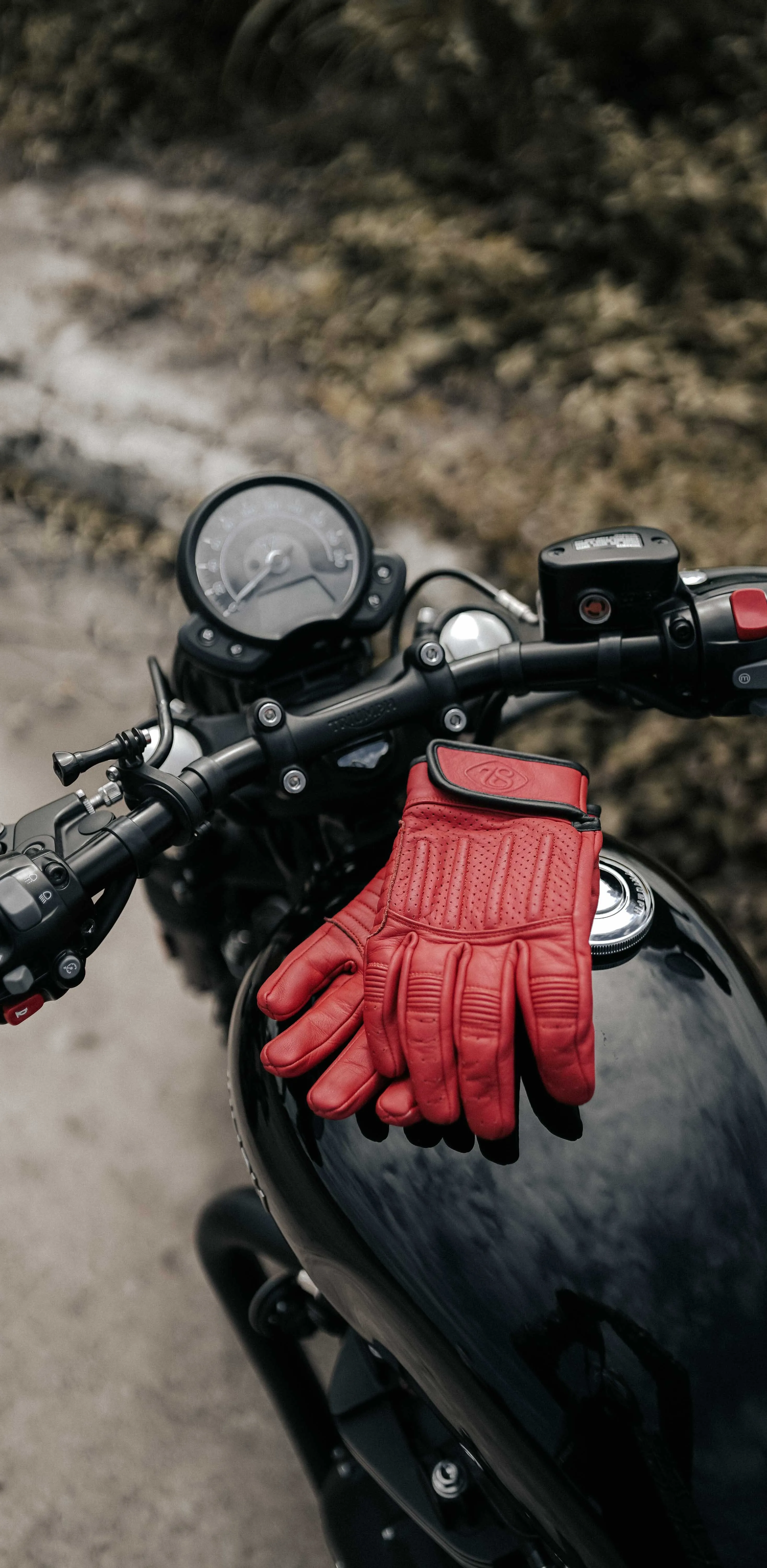 Close Up of Motorcycle Handlebar and Red Gloves Wallpaper