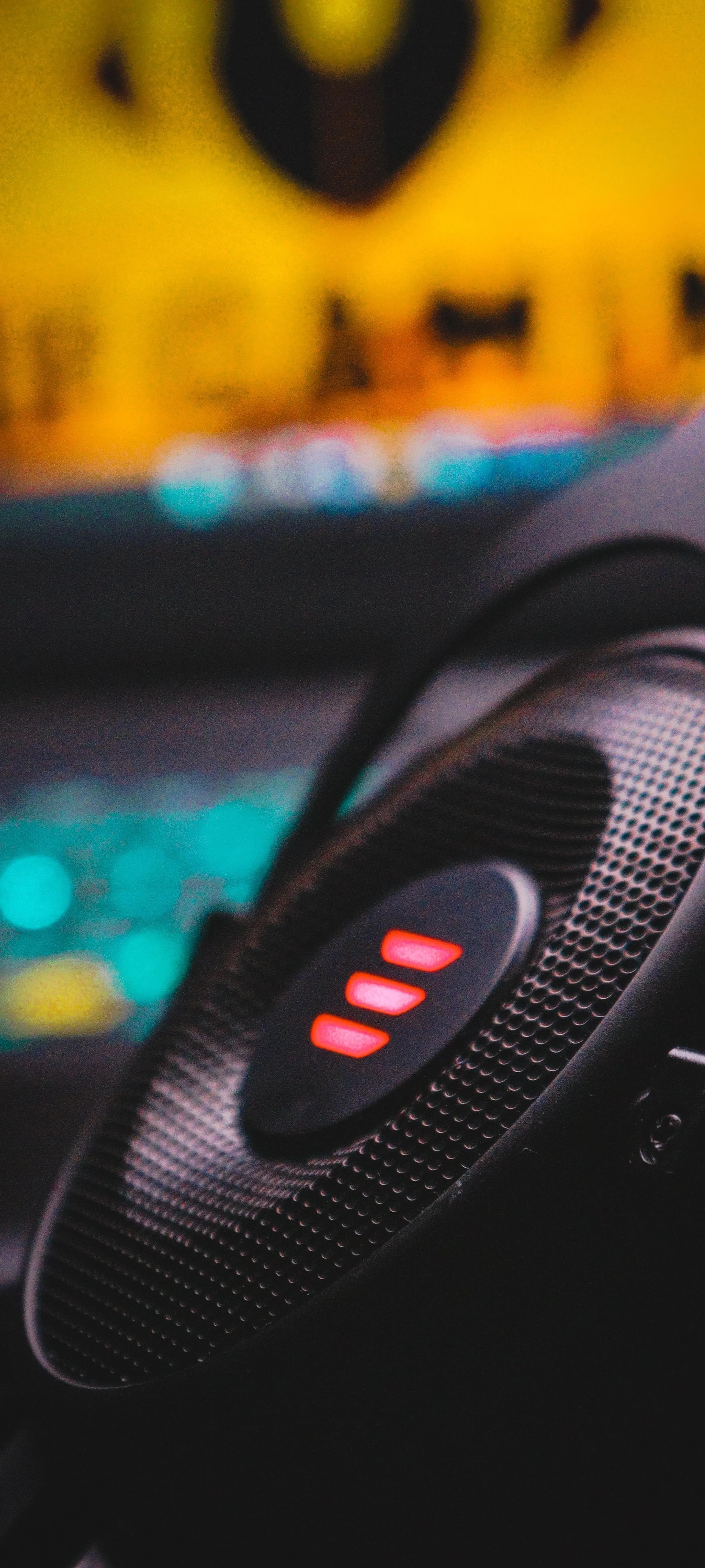 Close Up of Music Speaker with Vibrant Party Background