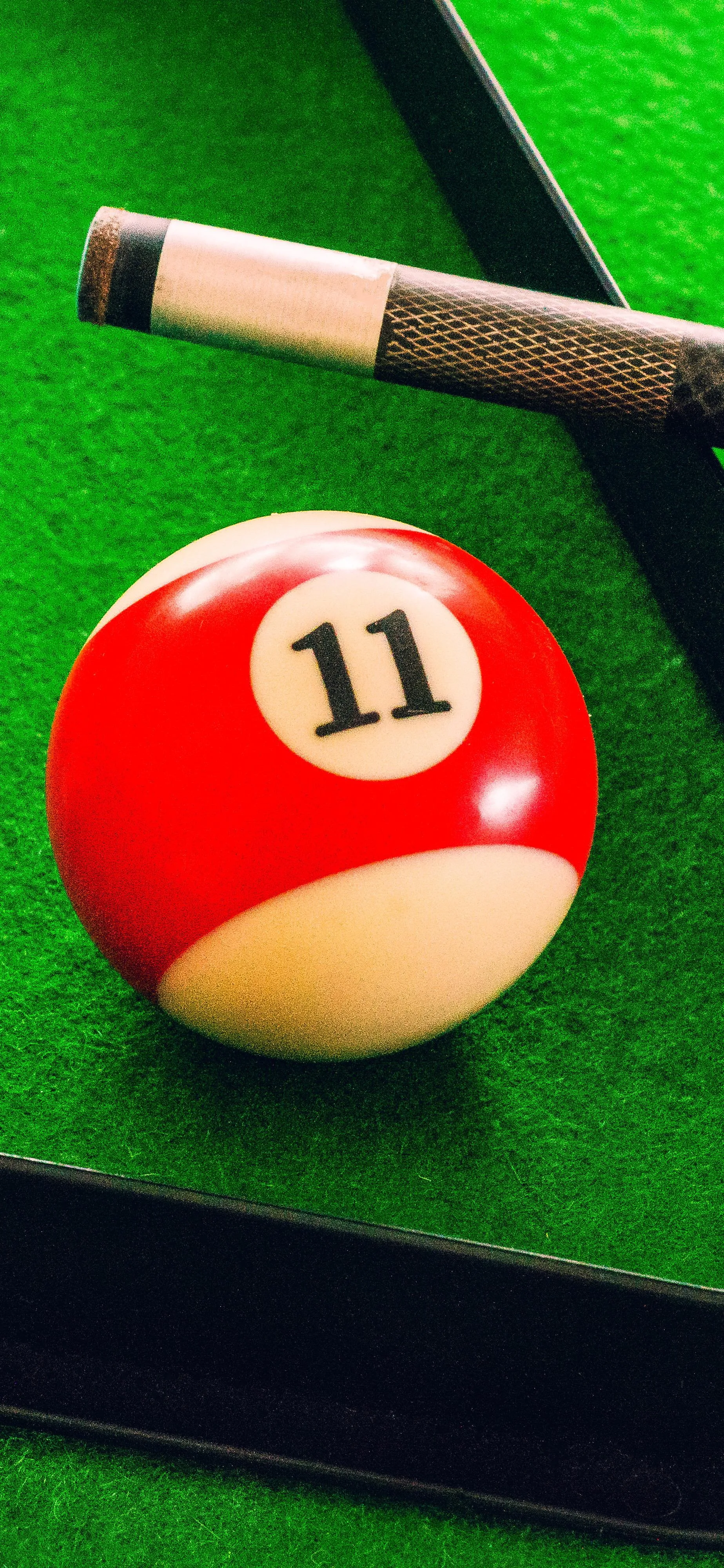 Close Up of Pool Table with Billiard Ball and Cue Stick