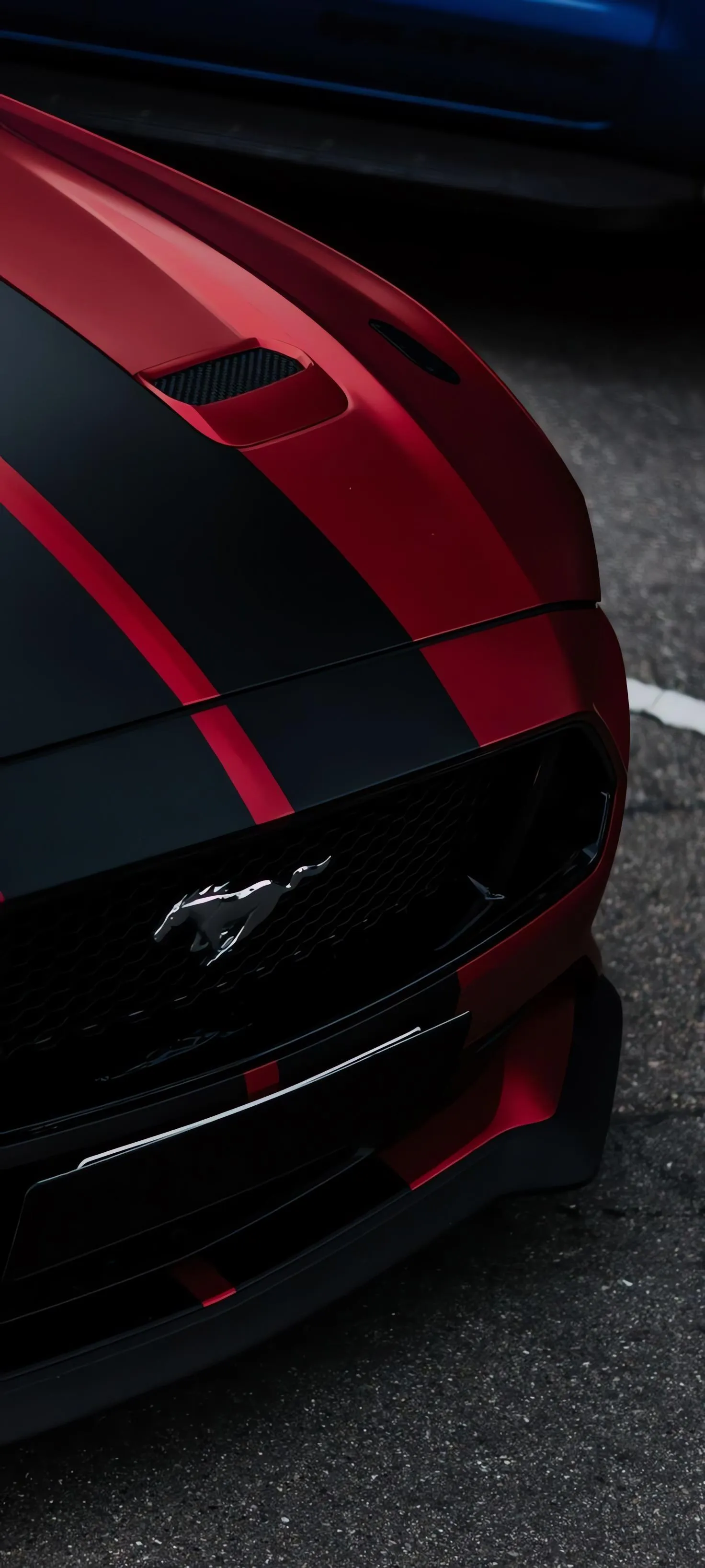 Close Up Of Red And Black Sports Car Headlight And Hood