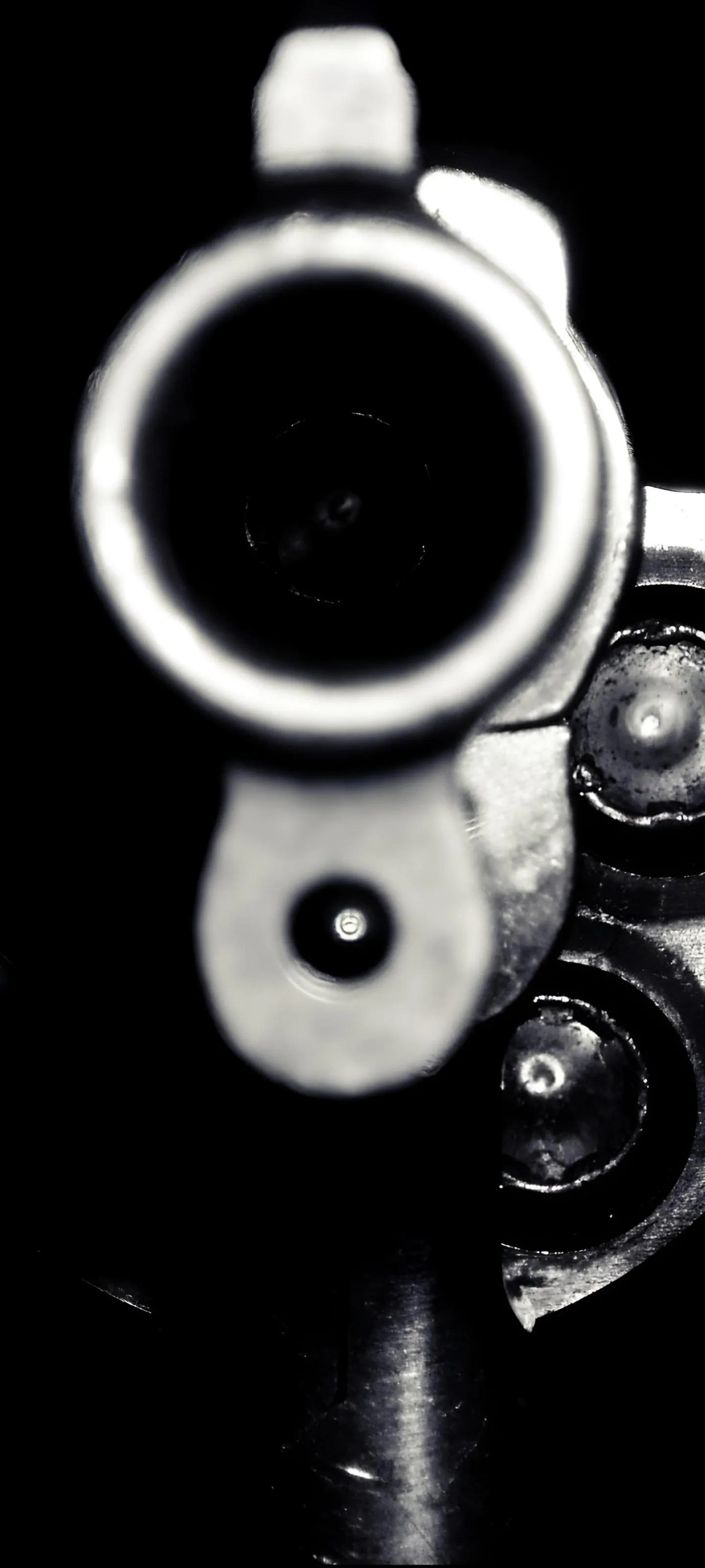 Close up view of a Gun Barrel in Dramatic Dark Lighting