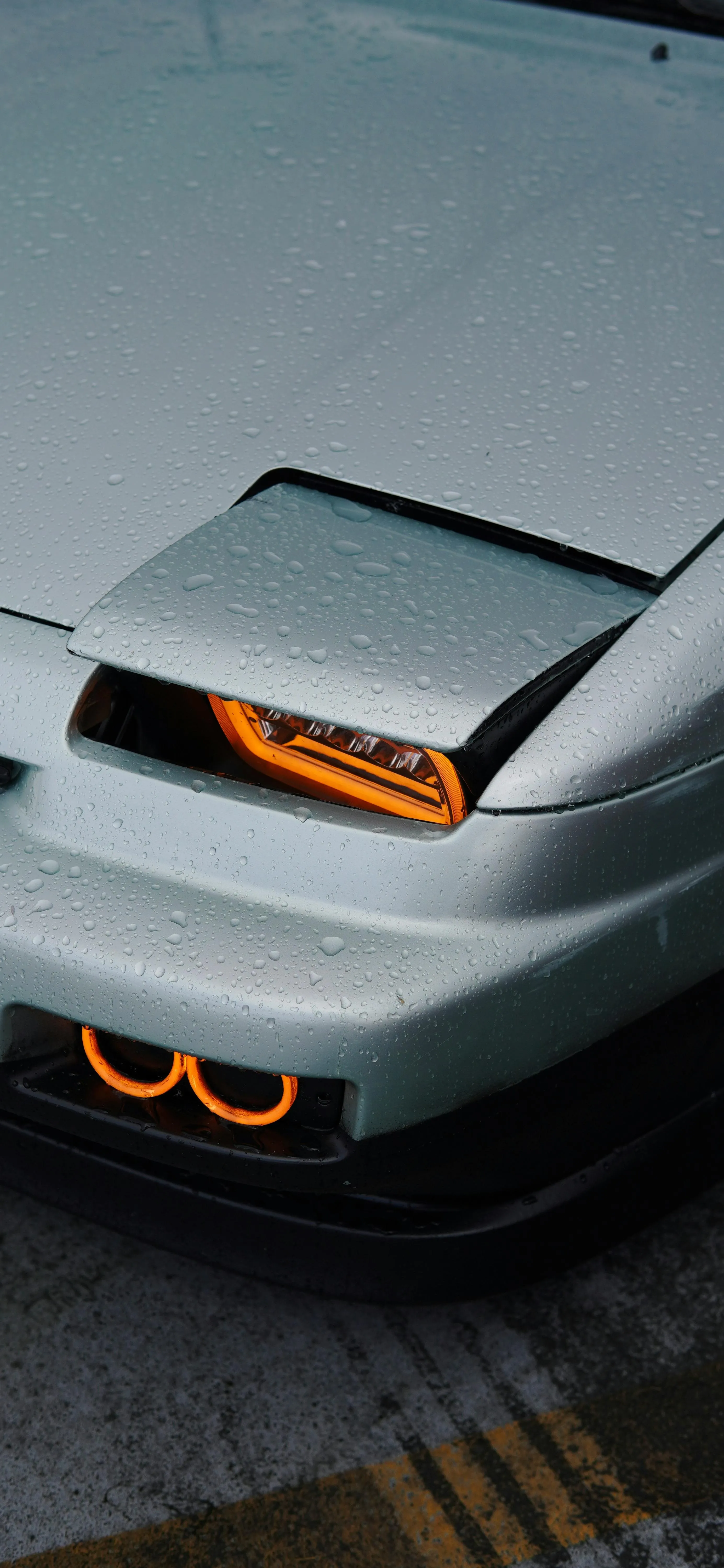 Close Up View of Sports Car Headlights and Grill Detail