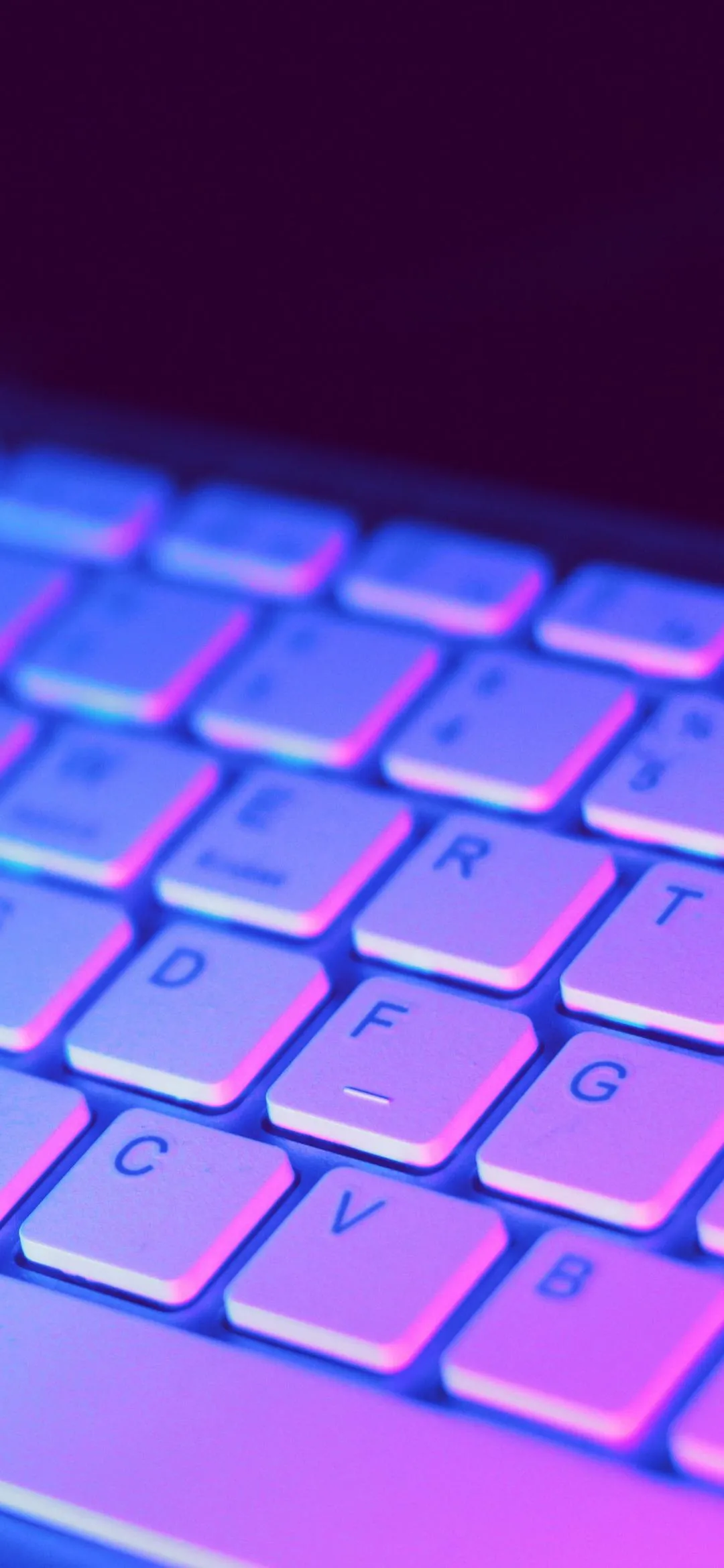 Closeup of Colorful Keyboard with Neon Glow Effect