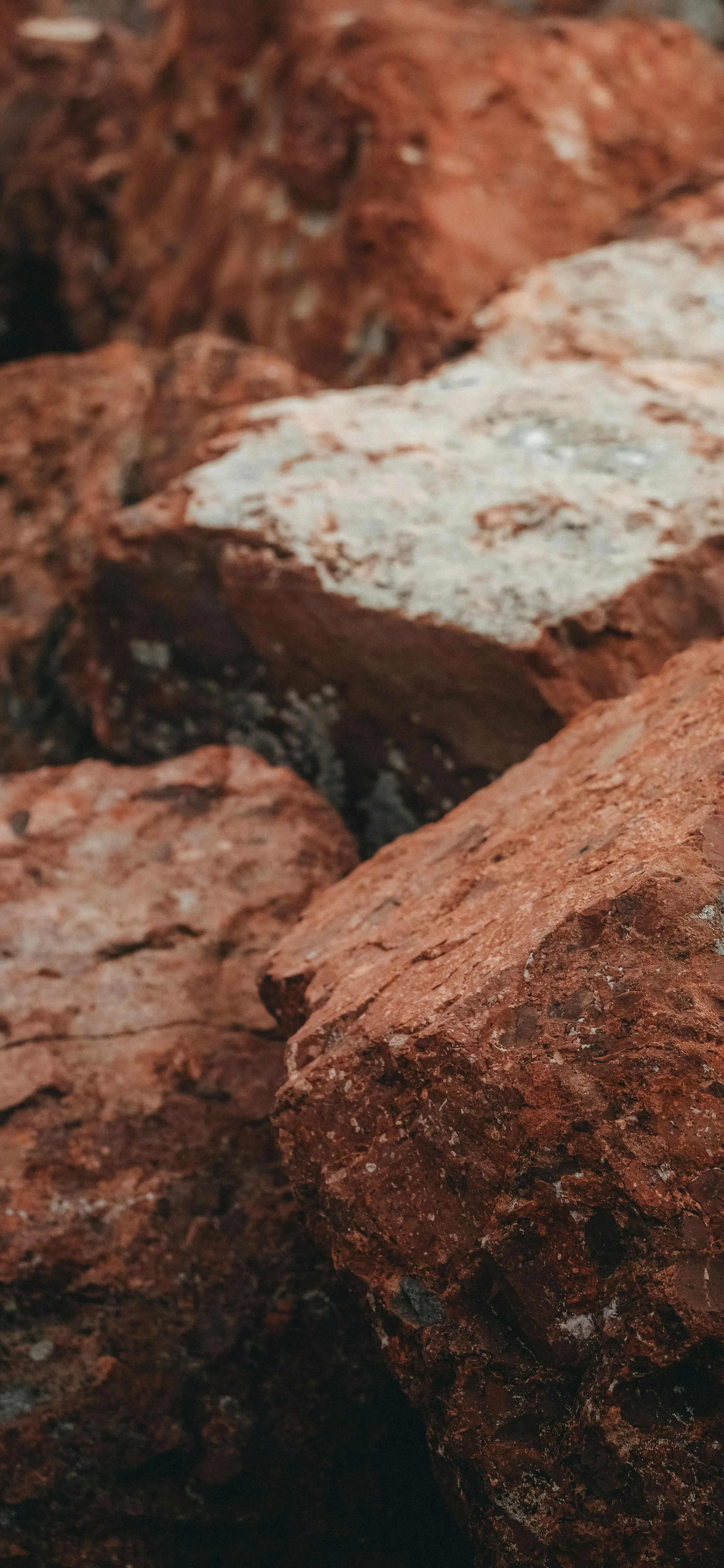 Closeup of Rough Red Rocks with Texture and Detail Wallpaper