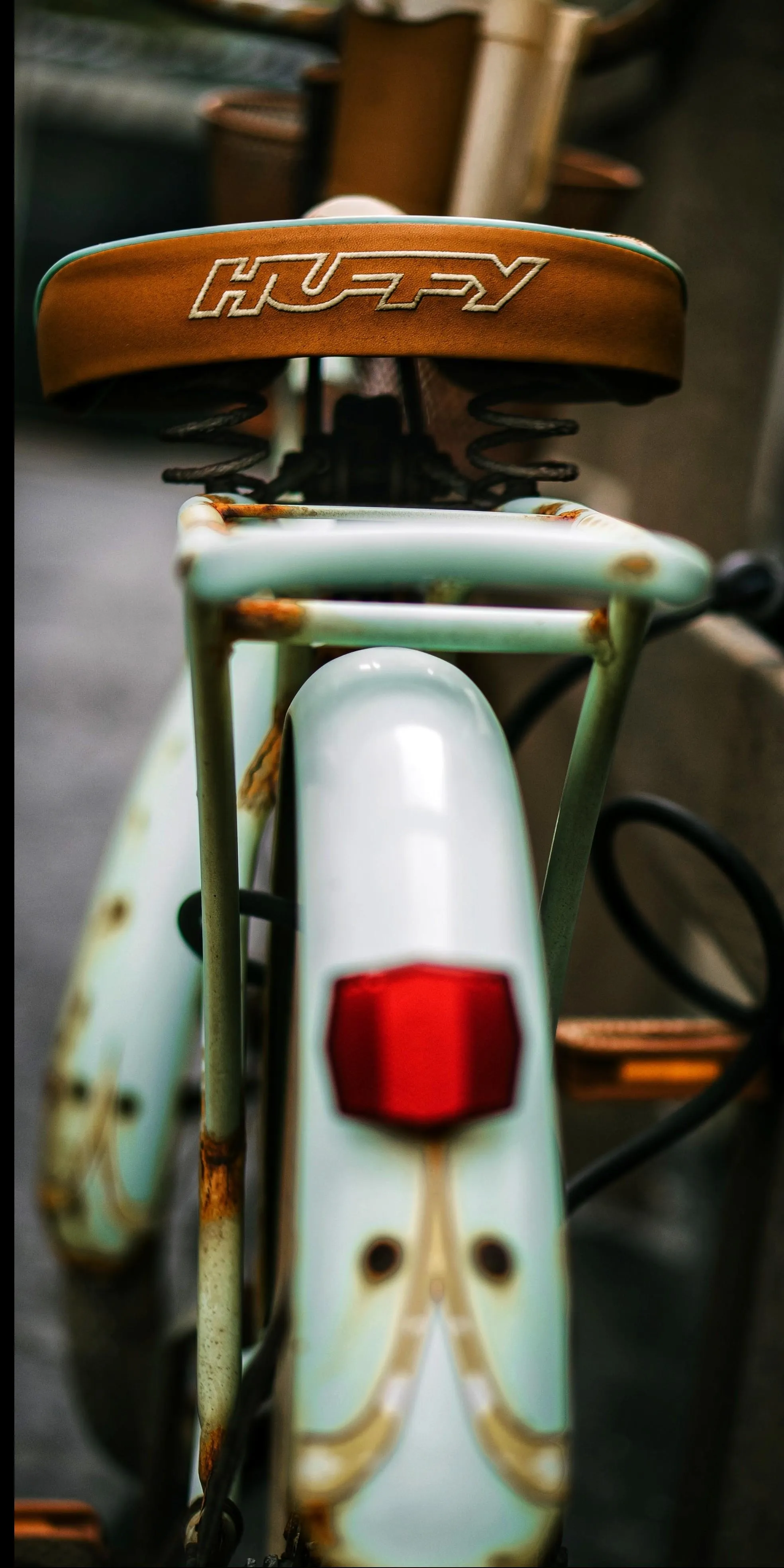 Closeup of Vintage Motorcycle Rearview Mirror and Tail