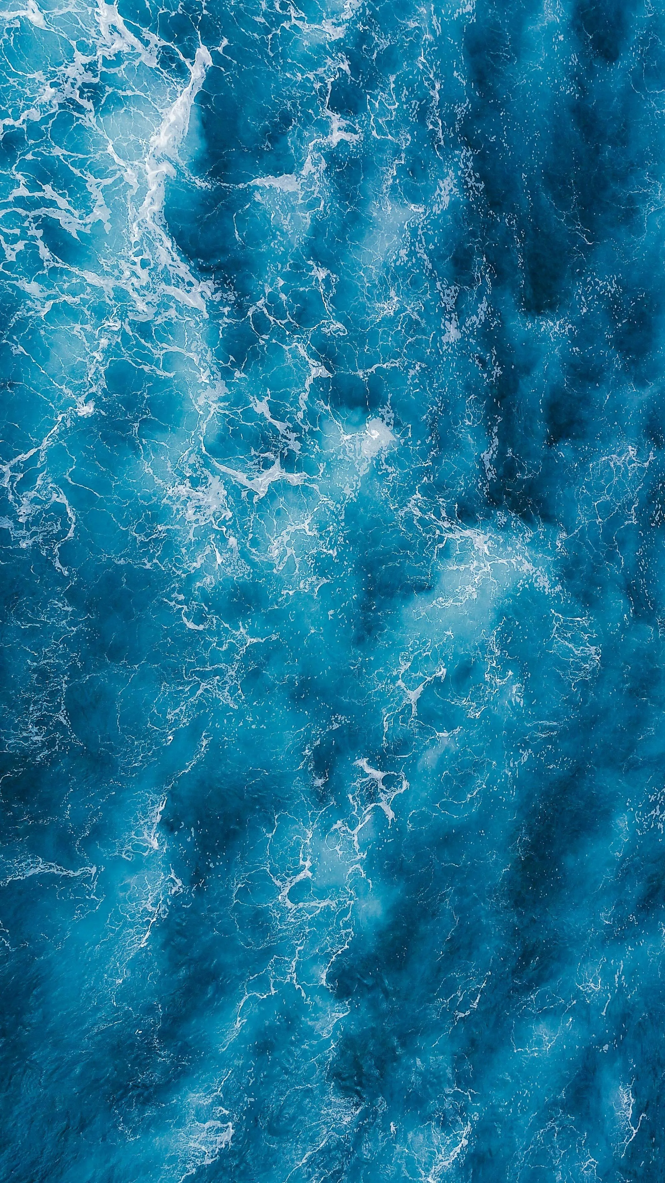 Closeup View of Blue Ocean Waves Crashing Water Image