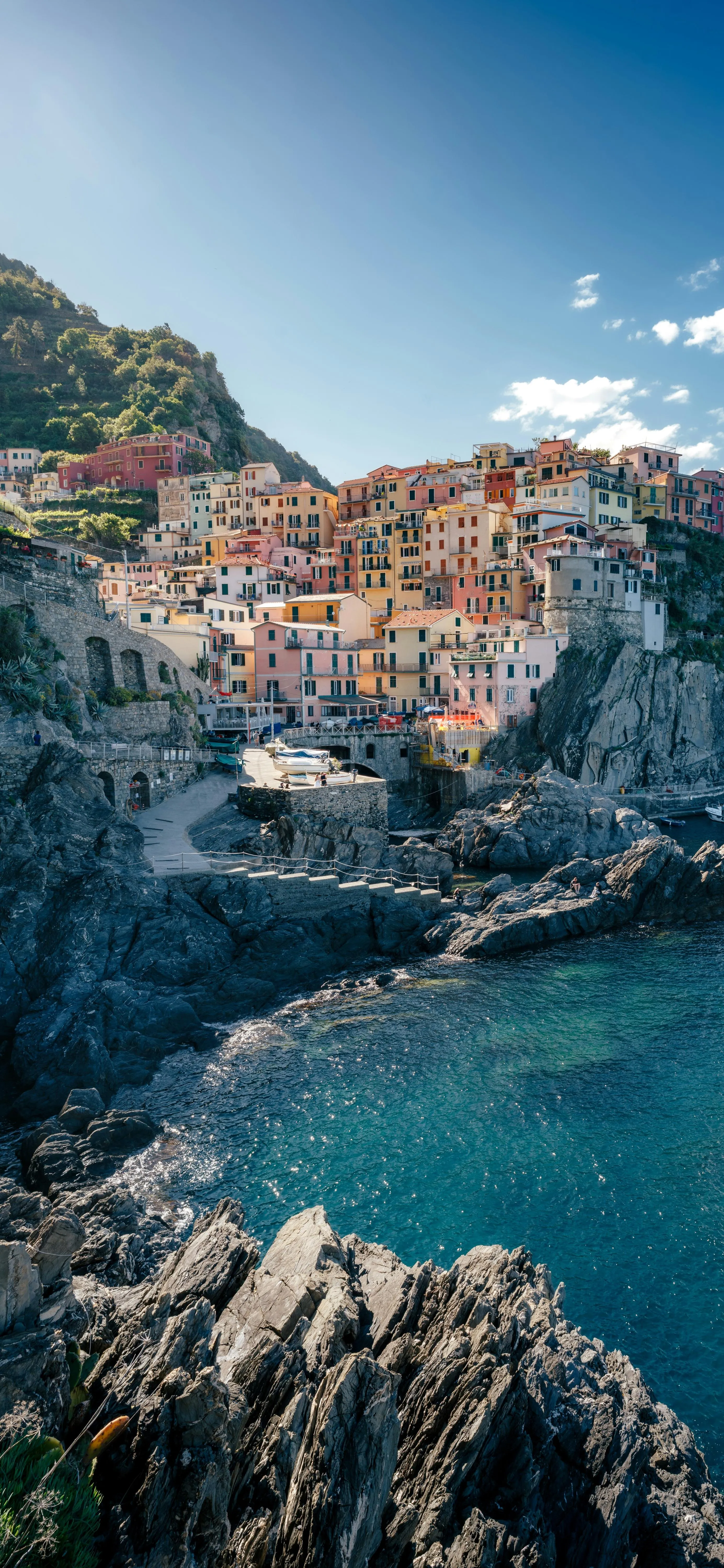Coastal Village on Cliffs Overlooking Clear Blue Sea Image