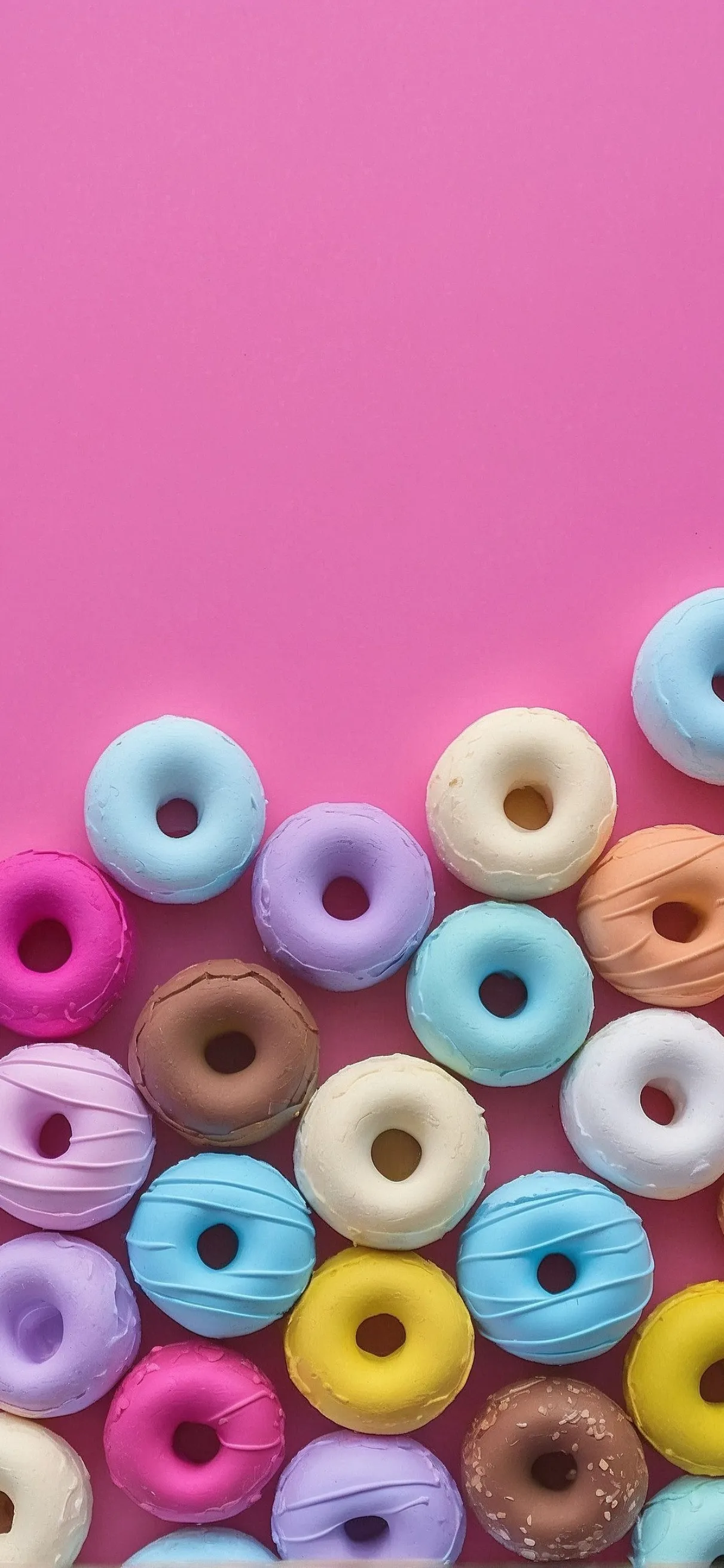 Colorful Assortment of Donut Cereal on Pink Background