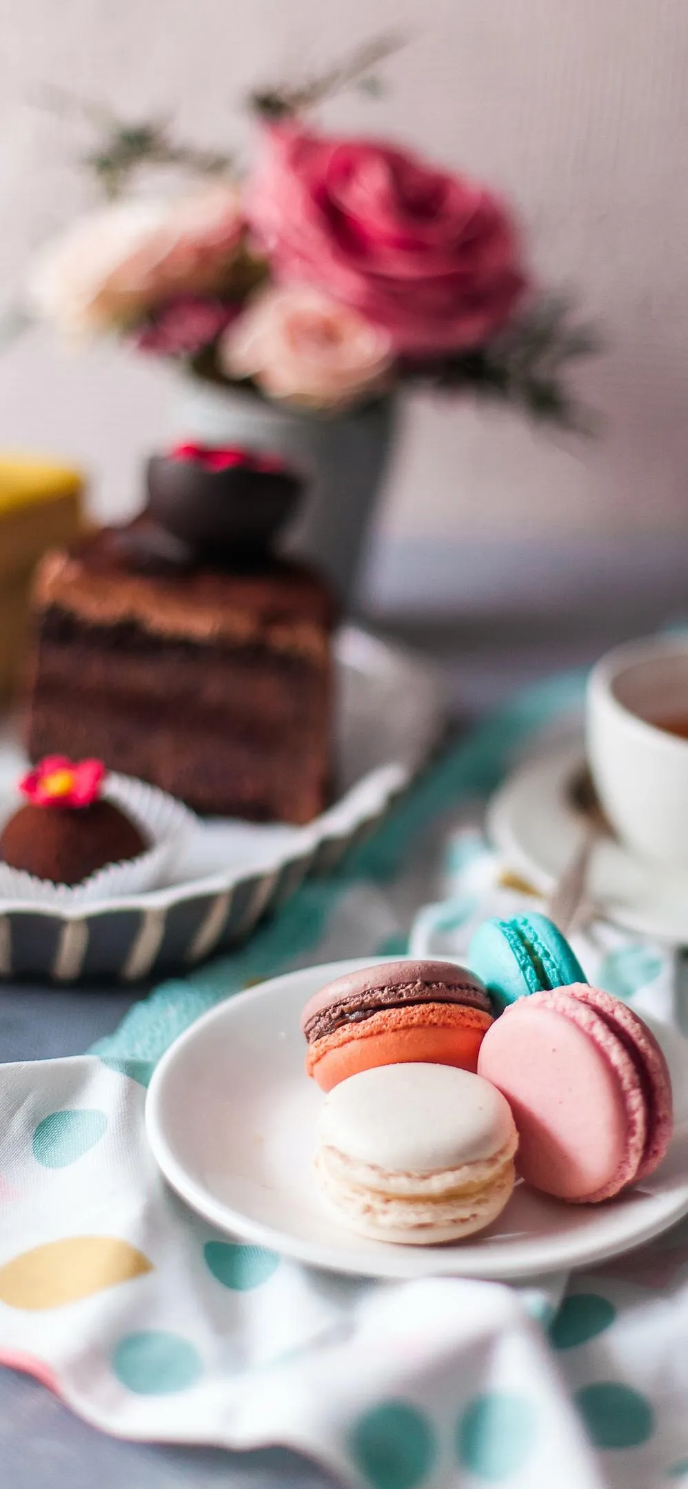 Colorful Macarons and Coffee on Wooden Table Wallpaper