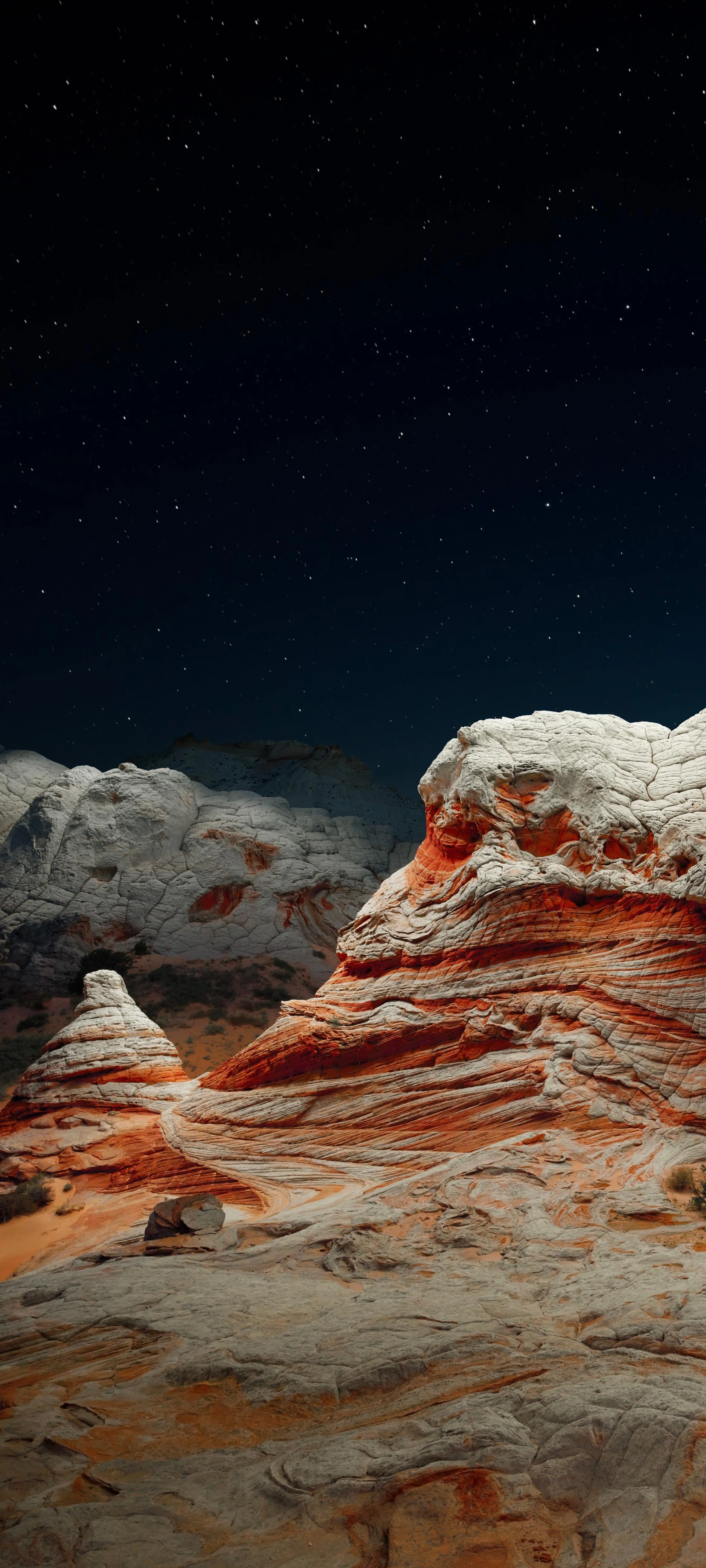 Colorful Rock Formations Under a Starry Night Sky Image