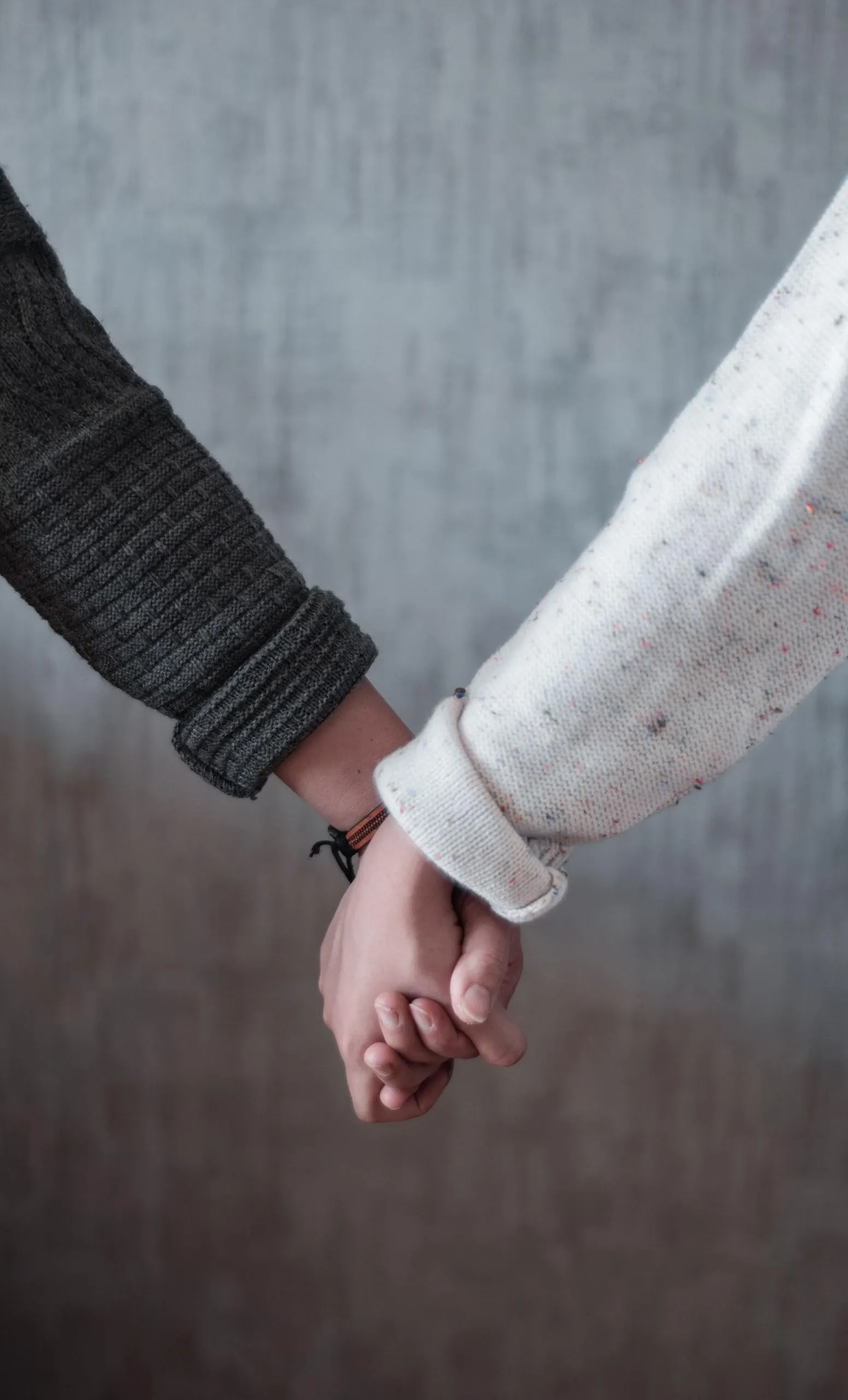 Couple Holding Hands in Soft Gentle Pastel Lighting