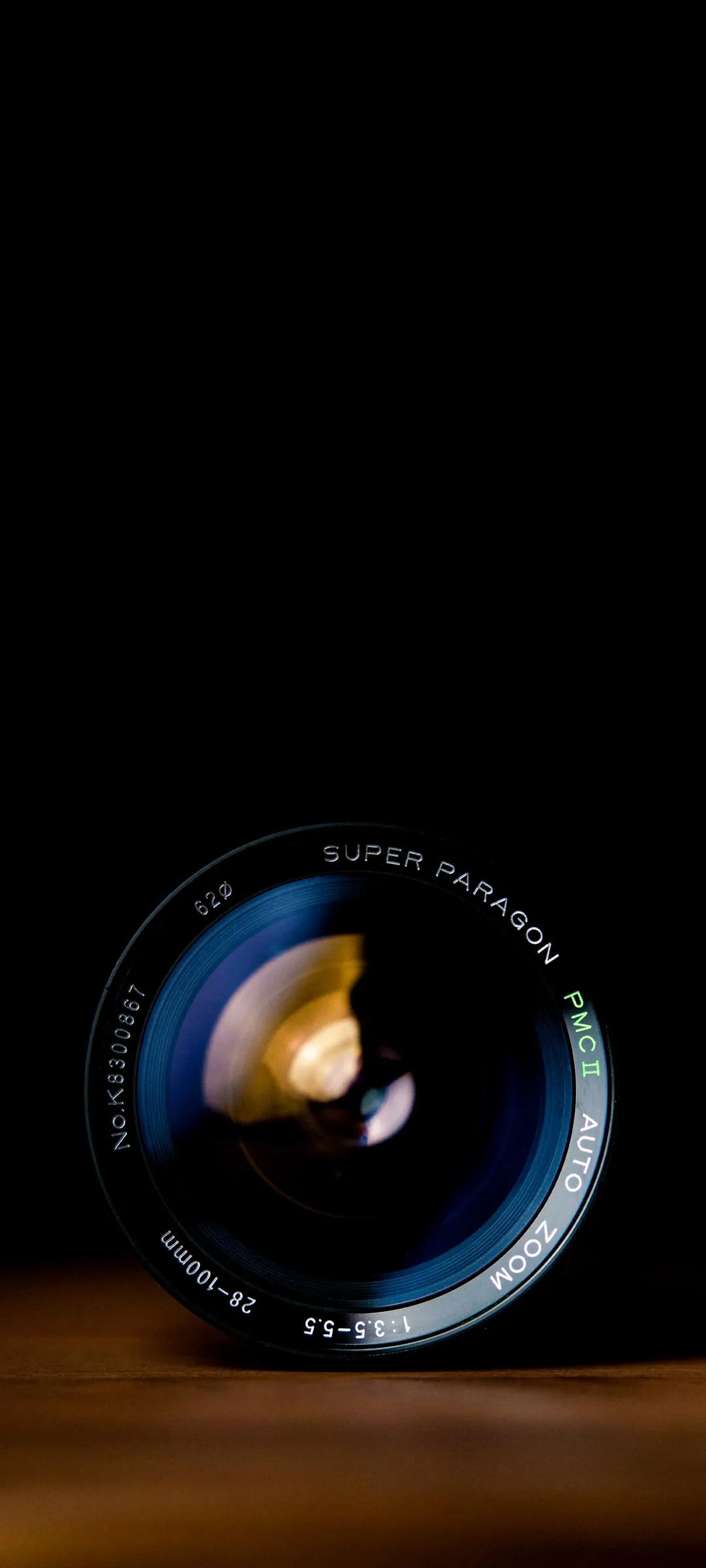 Crystal Glass Sphere Glowing on a Wooden Desk Wallpaper