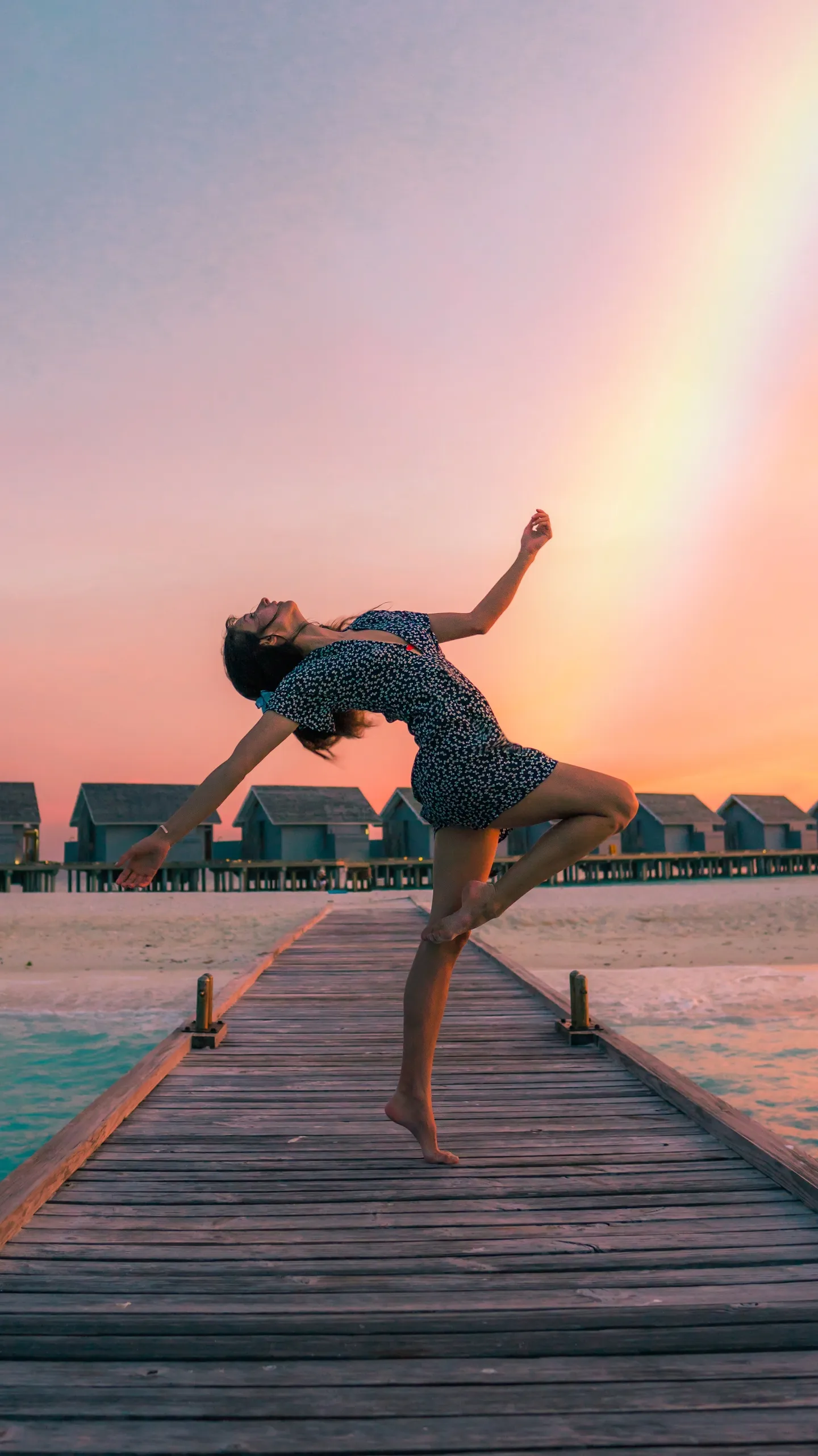 Dancer Performing on a Bridge During Sunrise Wallpaper