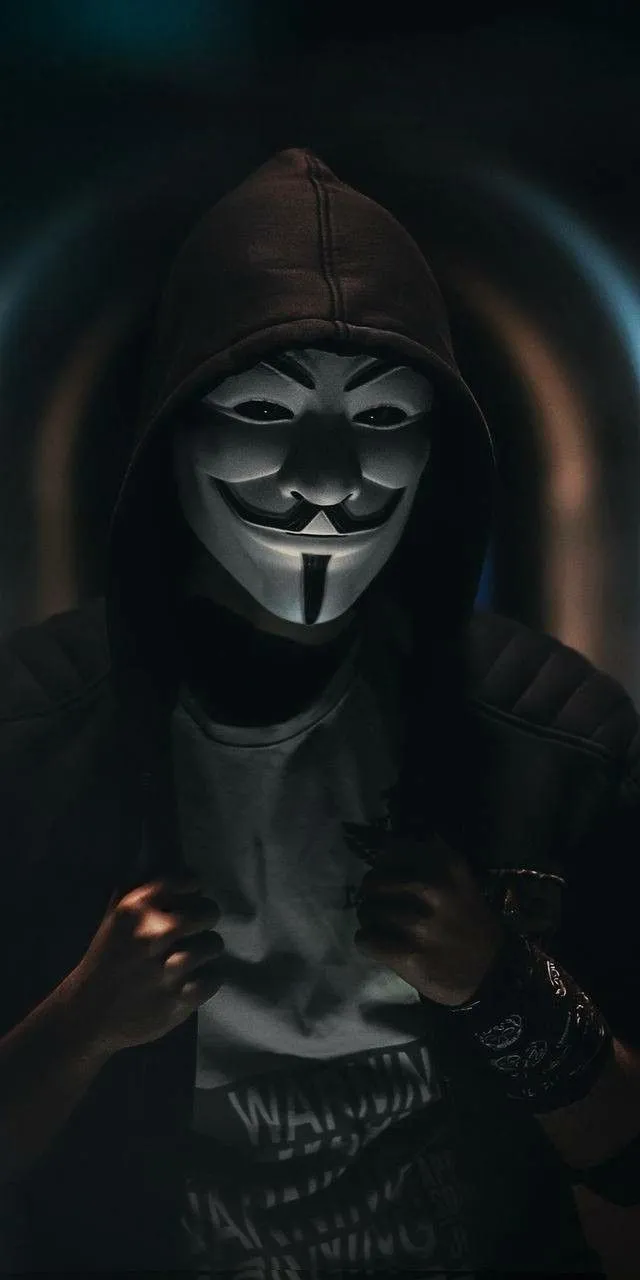 Dark Hooded Figure With Soft Light Forming Mysterious Mood