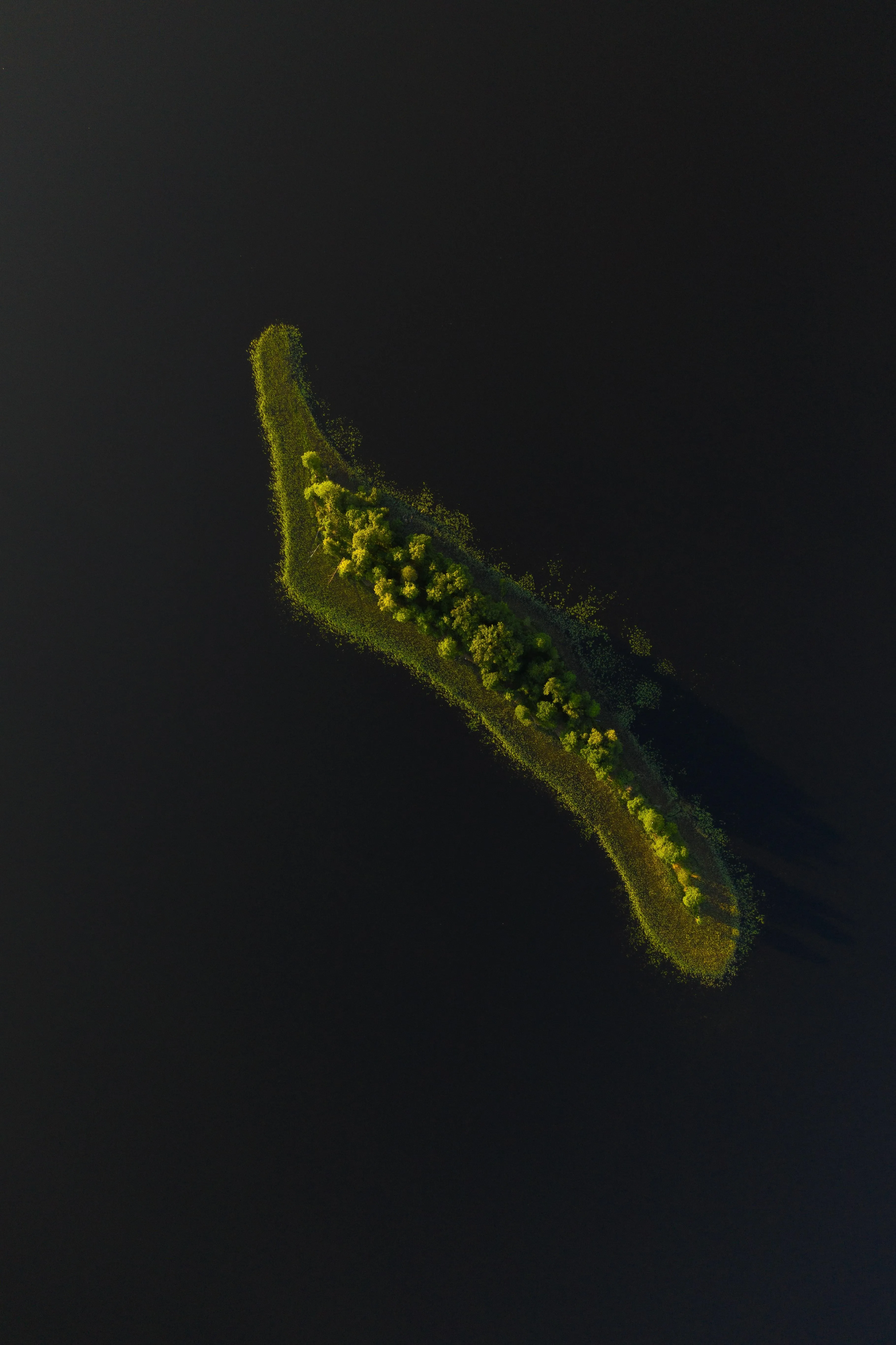 Dark Island Silhouette Floating in a Deep Black Background