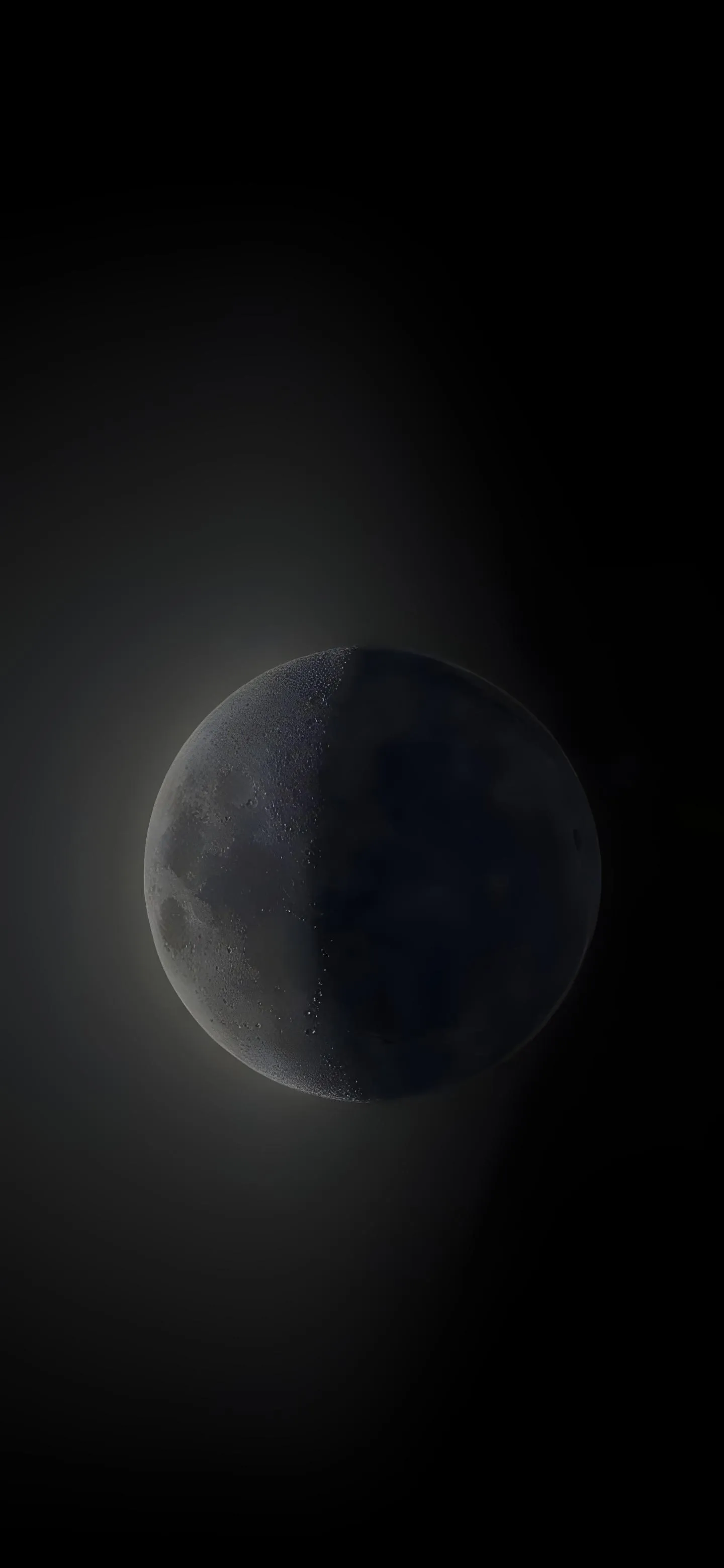Dark Moon Phase Over Black Sky with Subtle Light Wallpaper
