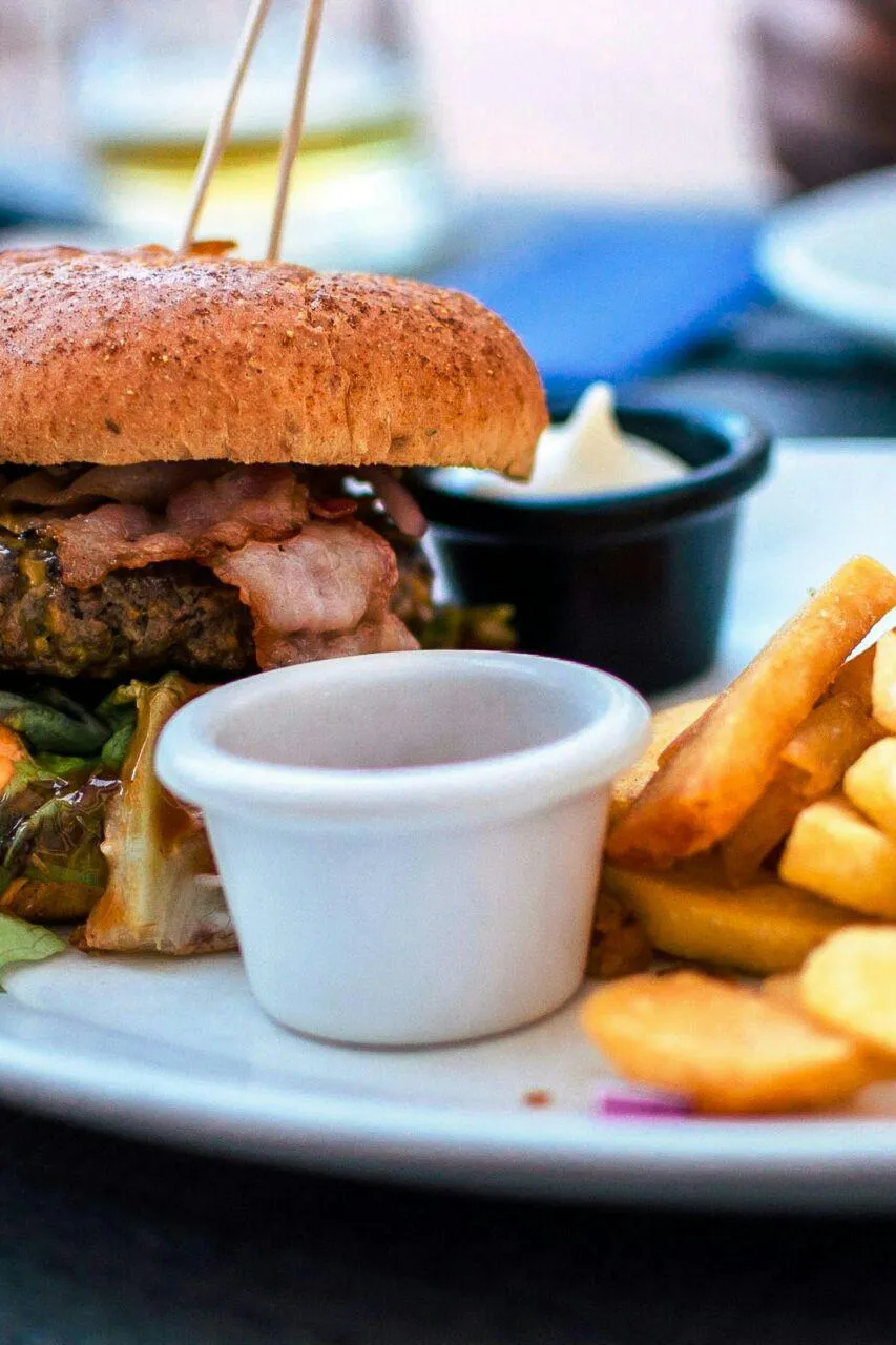 Delicious Burger and Fries with Tasty Sauce Meal Wallpaper