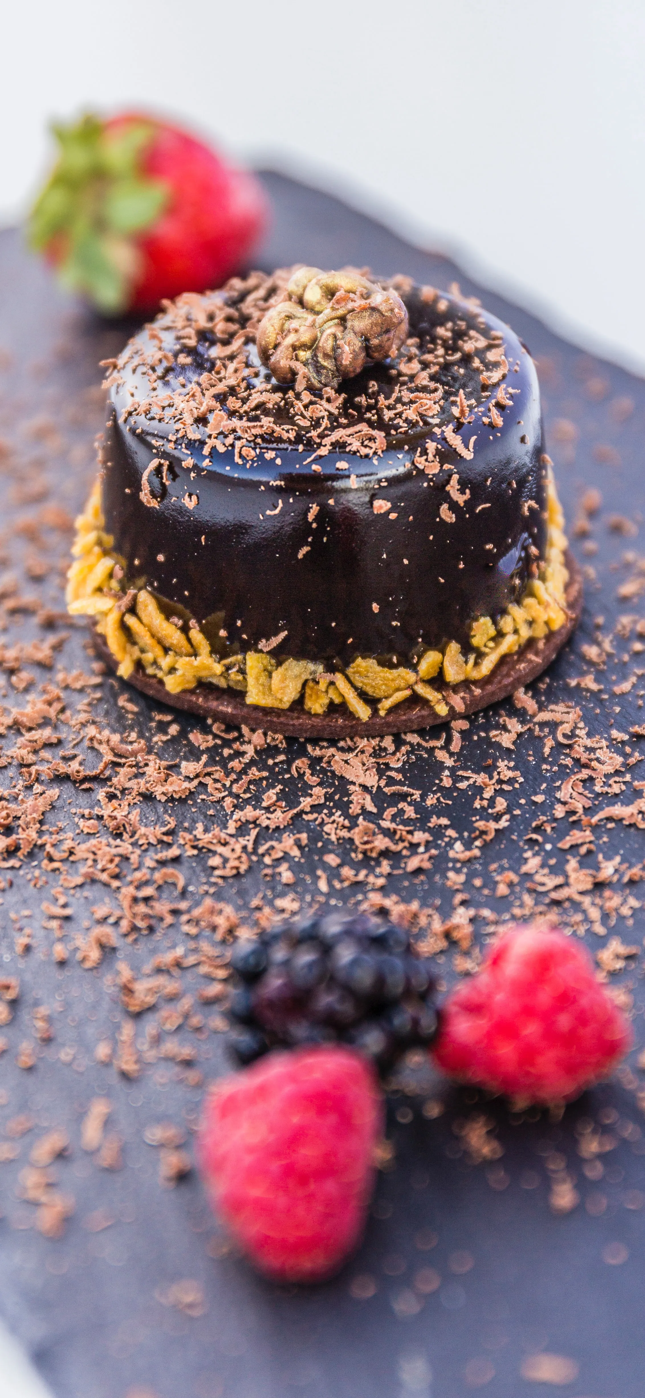 Delicious Chocolate Cake with Raspberries on White Plate