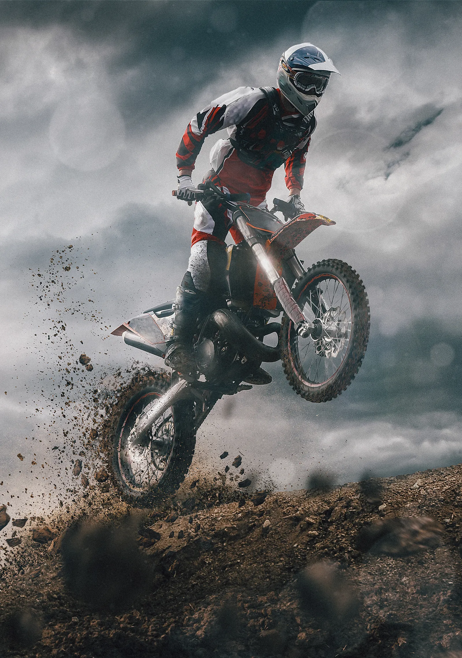Dirt Biker Jumping High in Cloudy Sky with Dust Trail