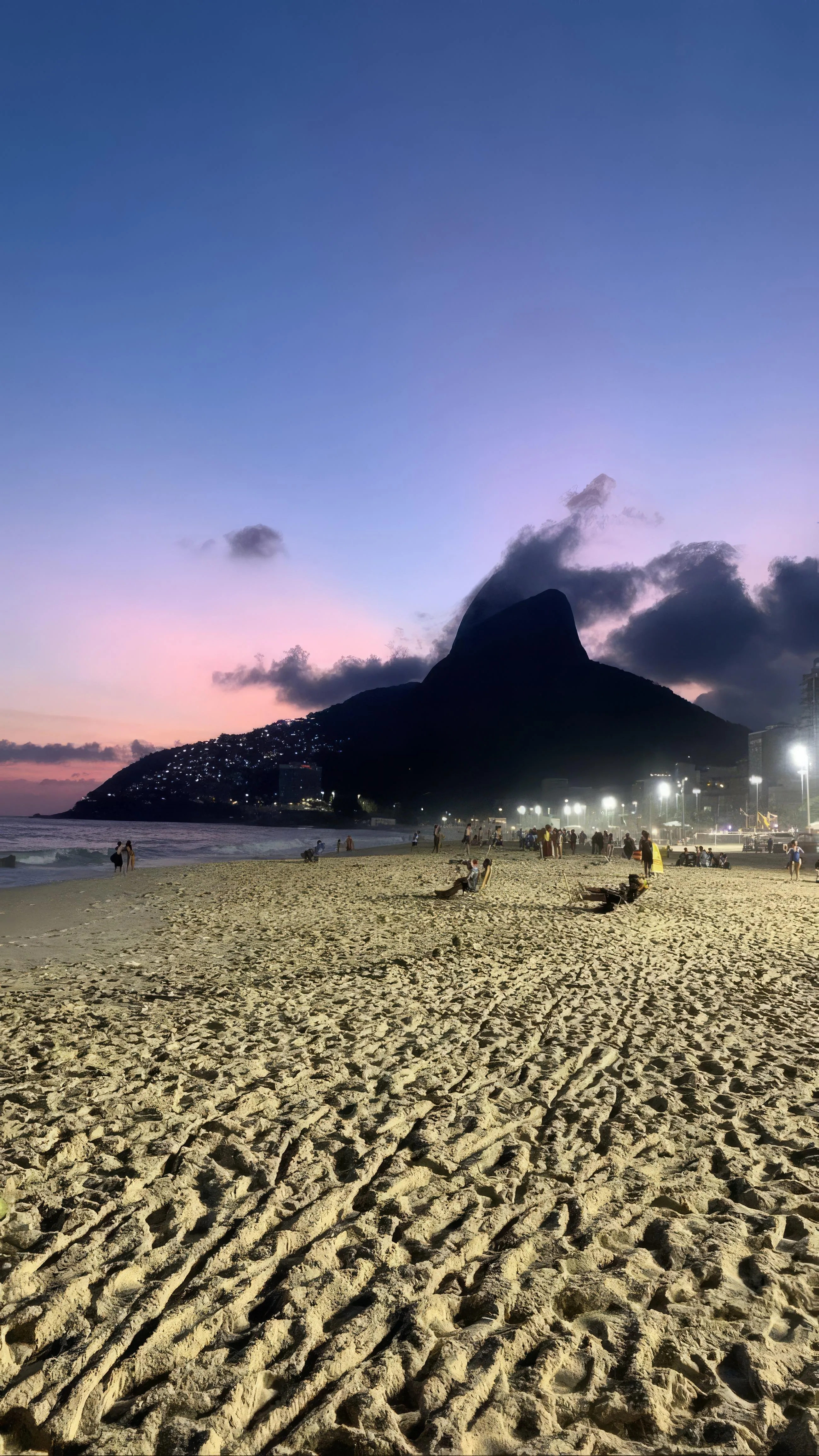Distant Mountain Under Purple Sky with Barren Landscape