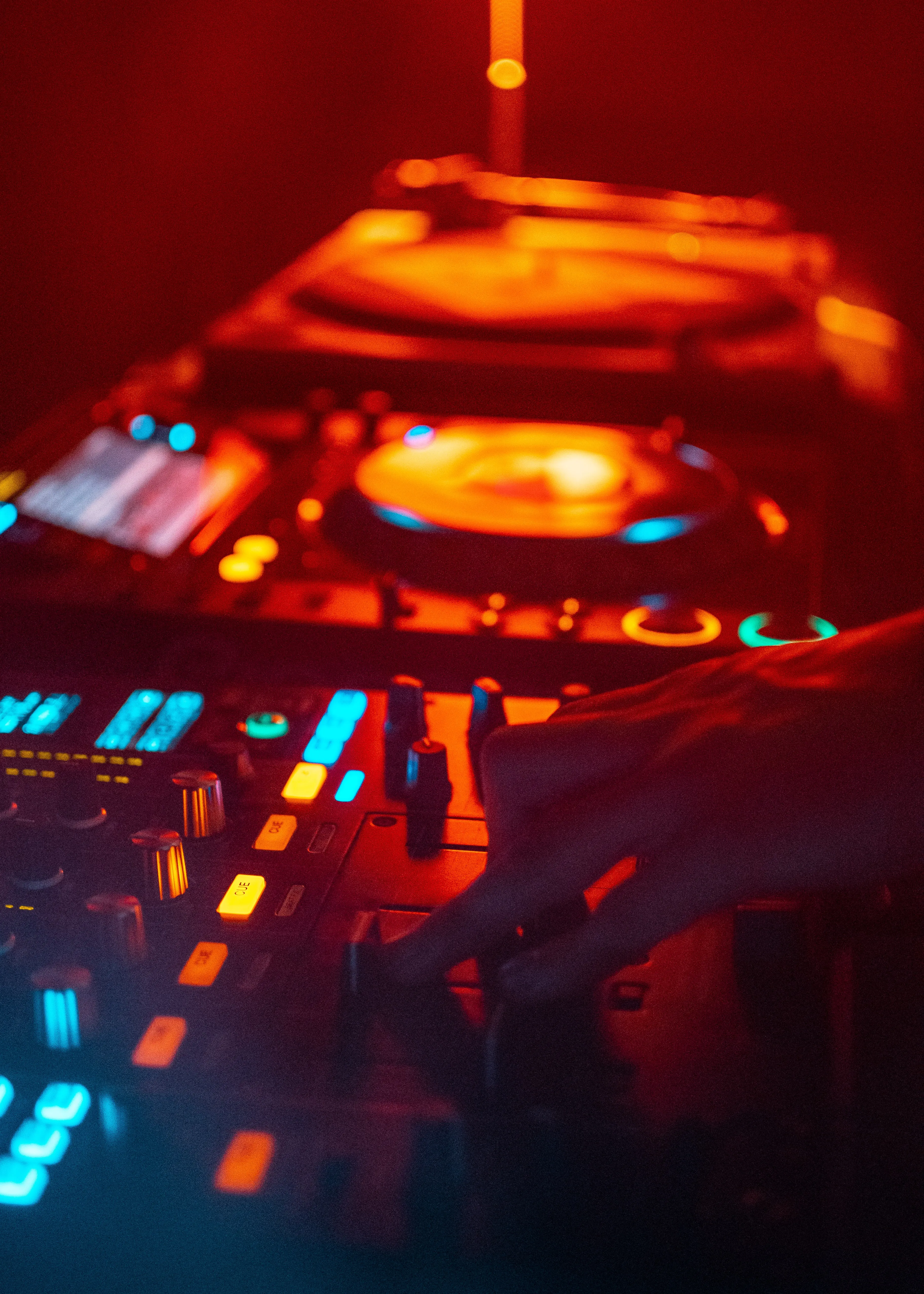 Dj Turntable Glowing in Red and Blue Party Lights Wallpaper