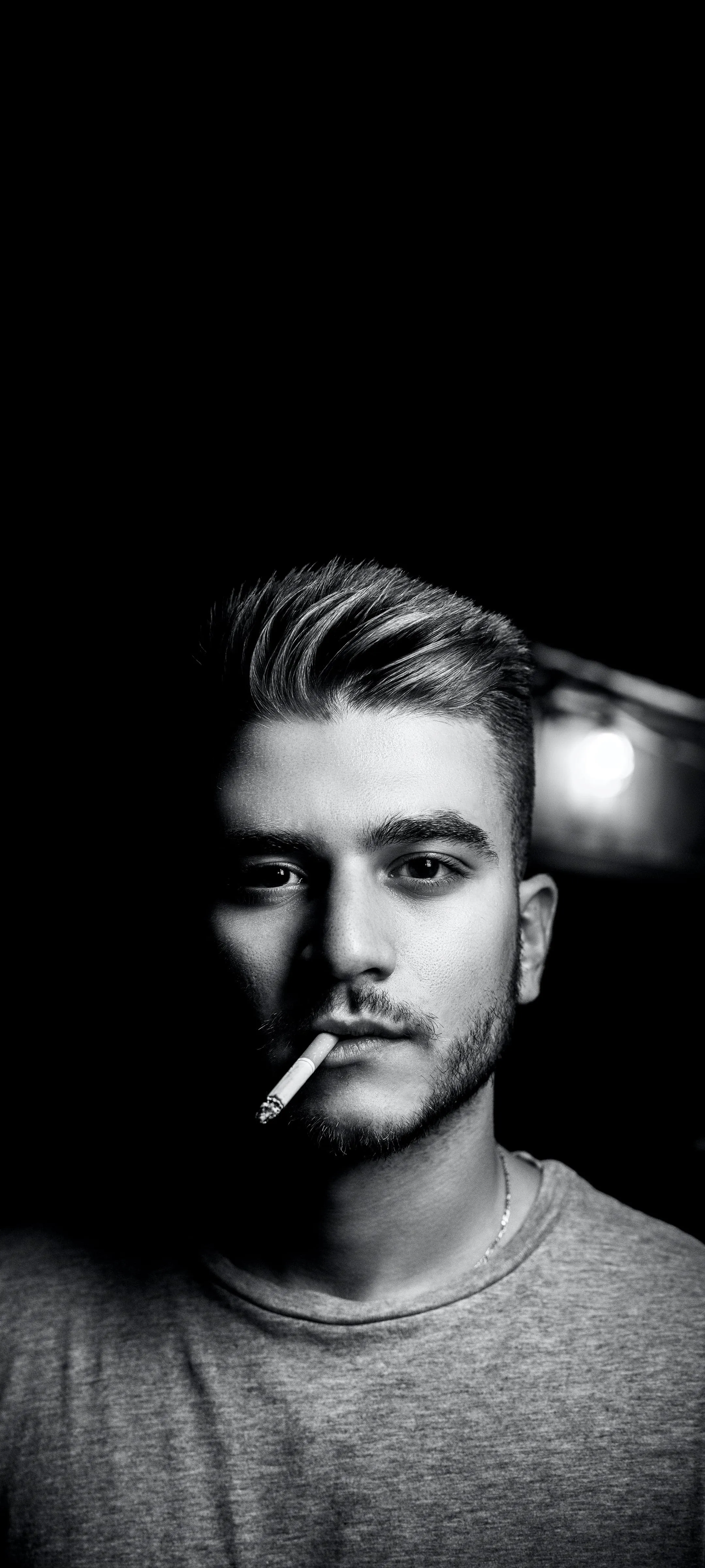 Dramatic Portrait of a Man Lit with Strong Monochrome Tone