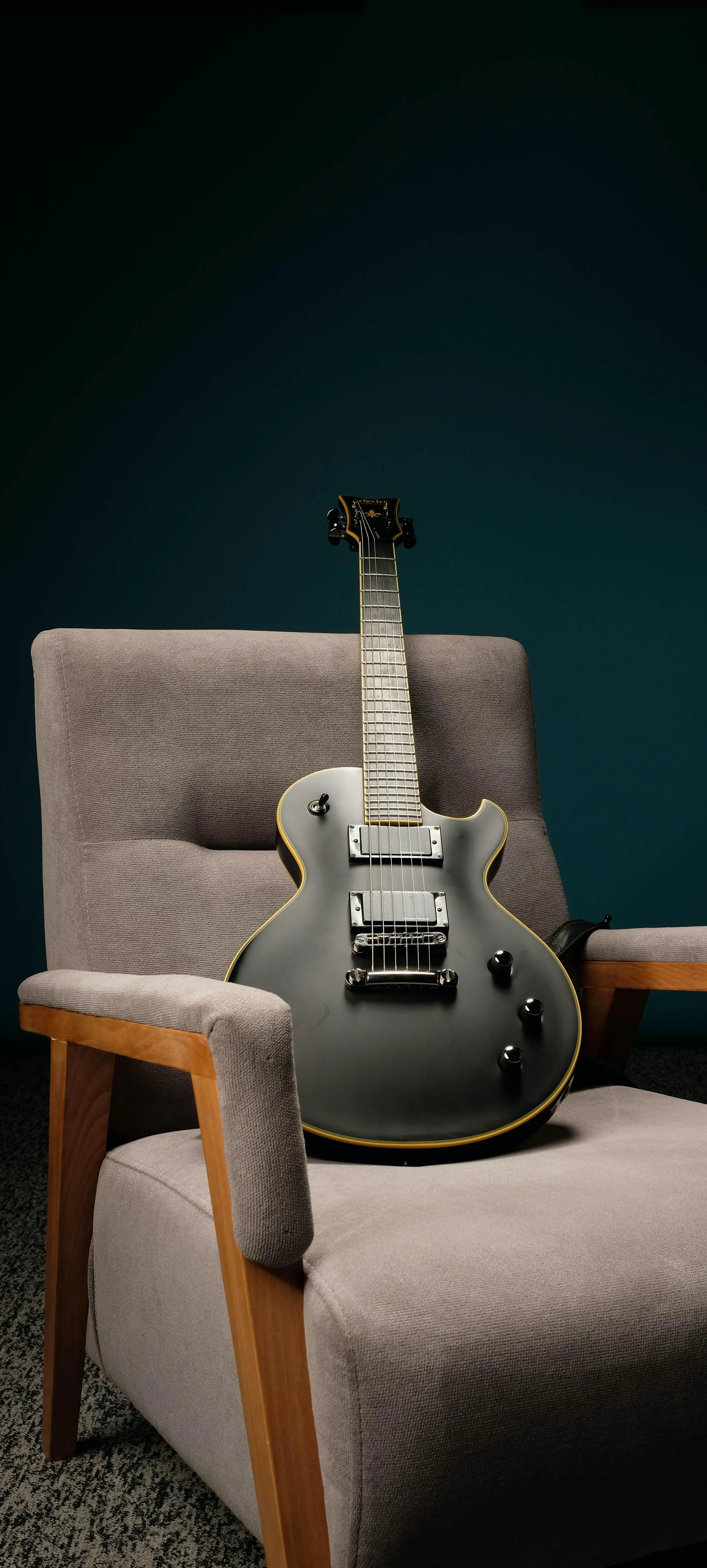 Electric Guitar Resting on Chair in Music Studio Setting