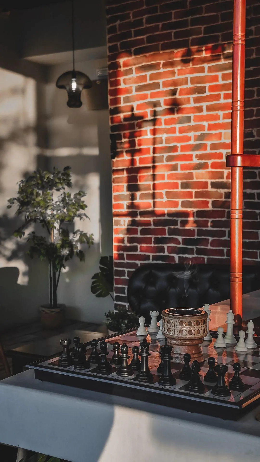 Elegant Chess Set in Cozy Sunlit Cafe Corner Interior image