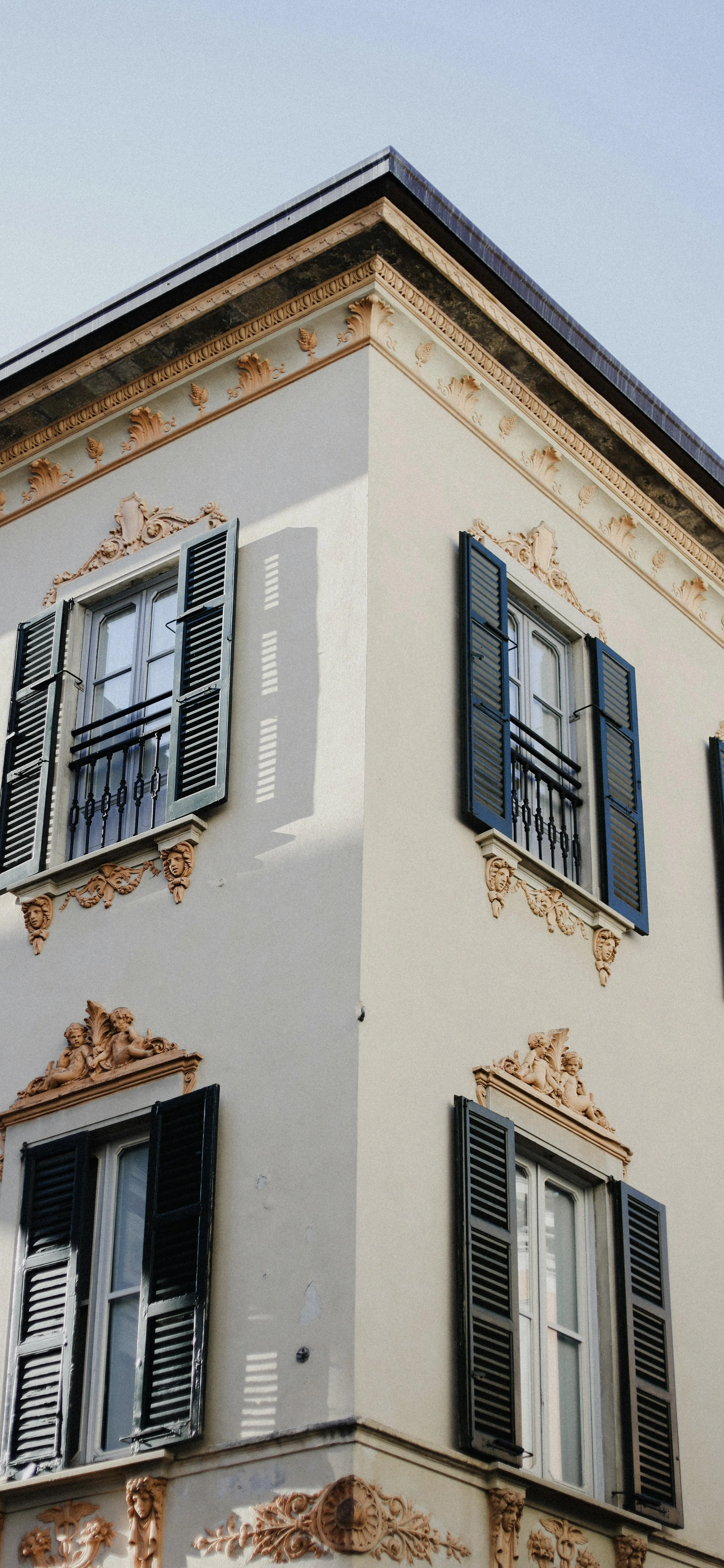 European Building with Window Shutters Wallpaper for Phone