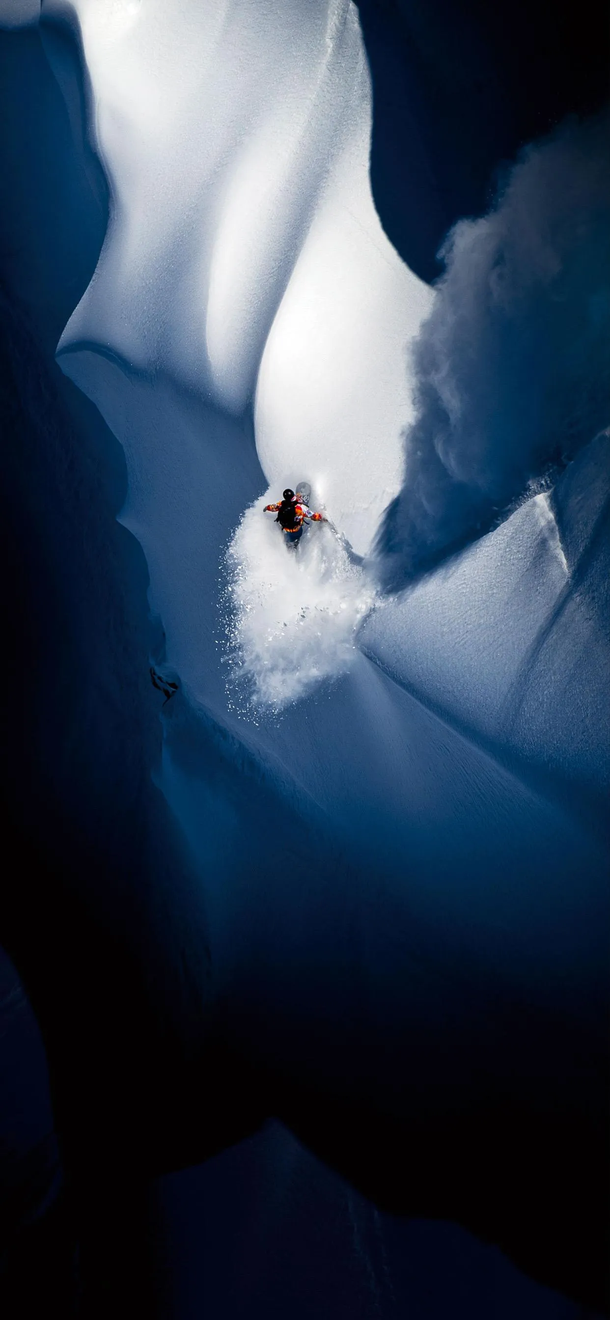 Extreme Snowboarding Through Steep Alpine Powder Image