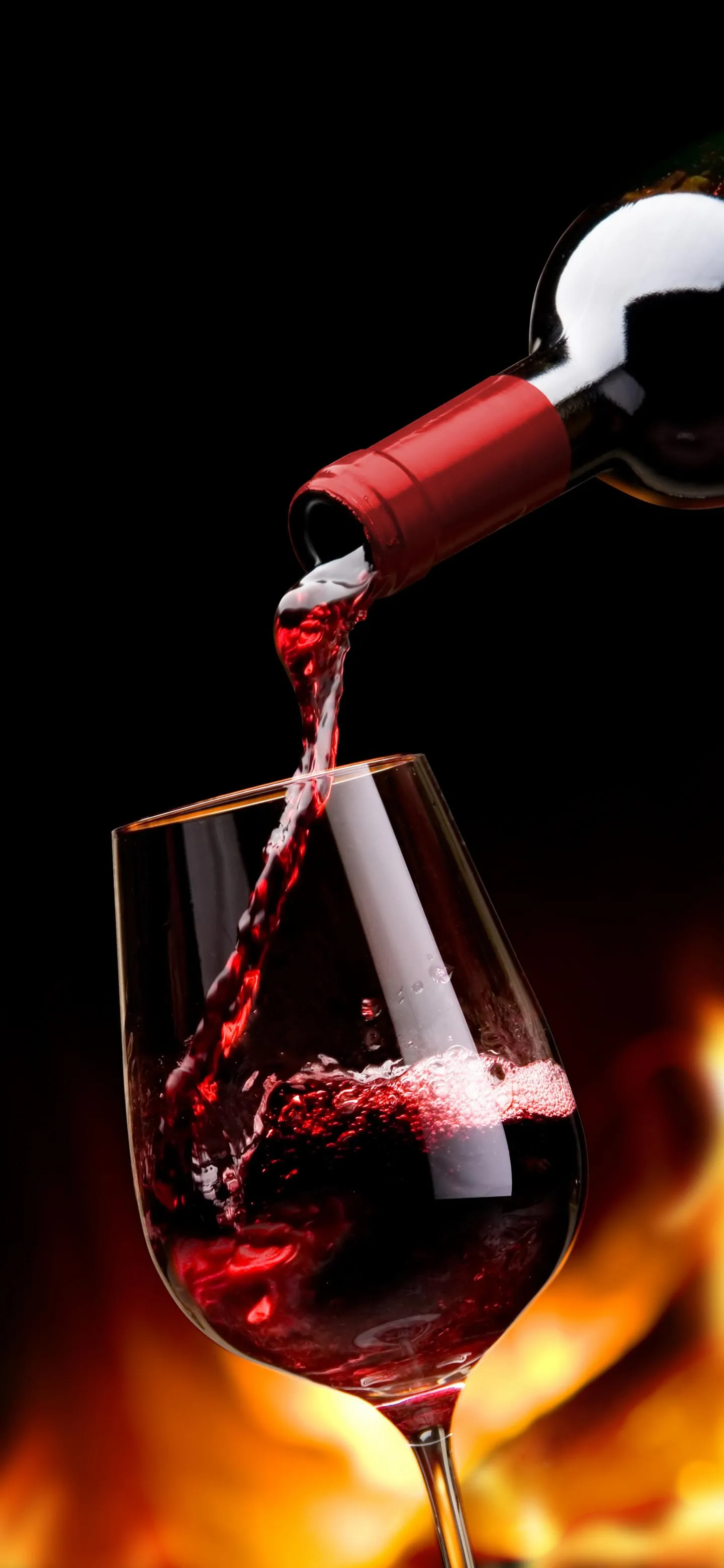 Fine Red Wine Pouring into Glass with Elegant Warm Light