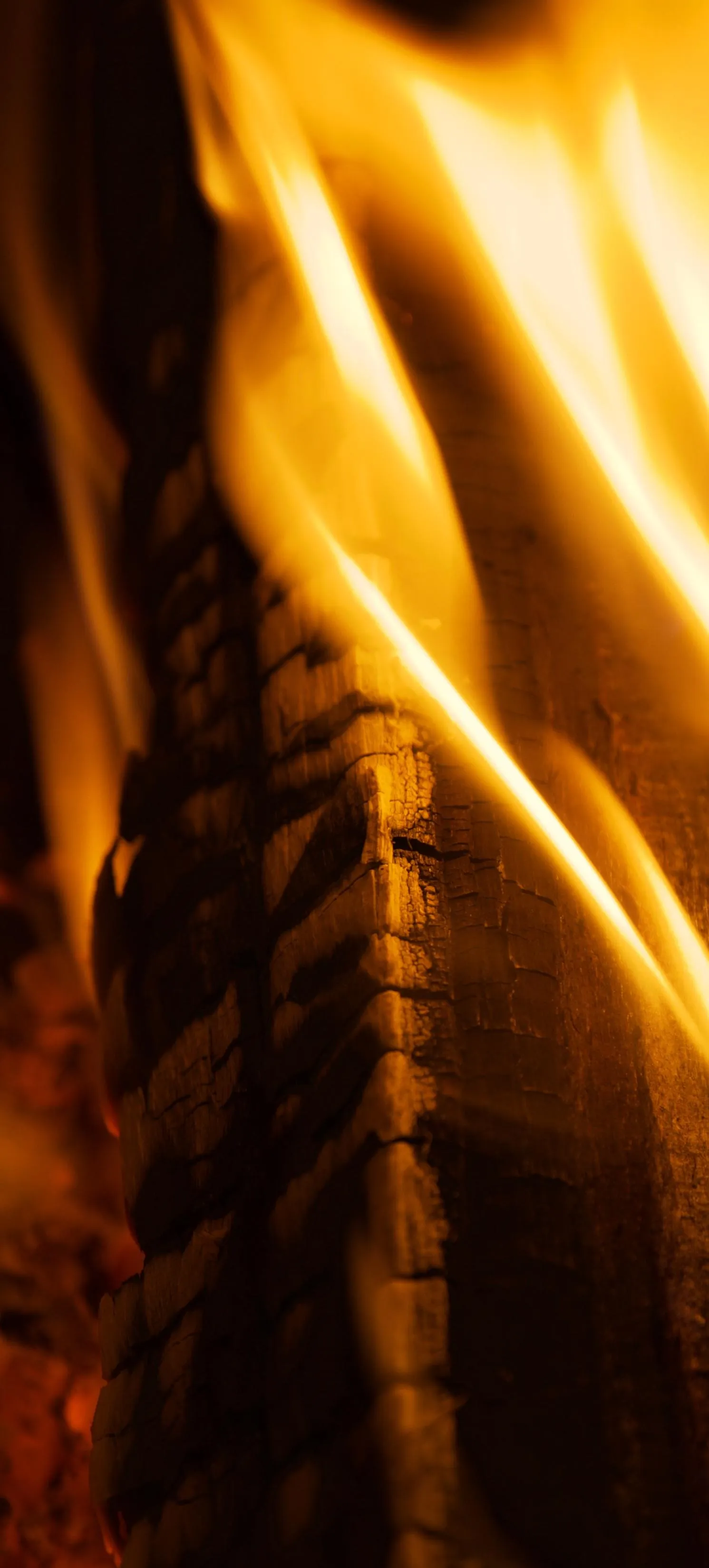 Fire Flames Close Up in Warm Golden Lighting Wallpaper