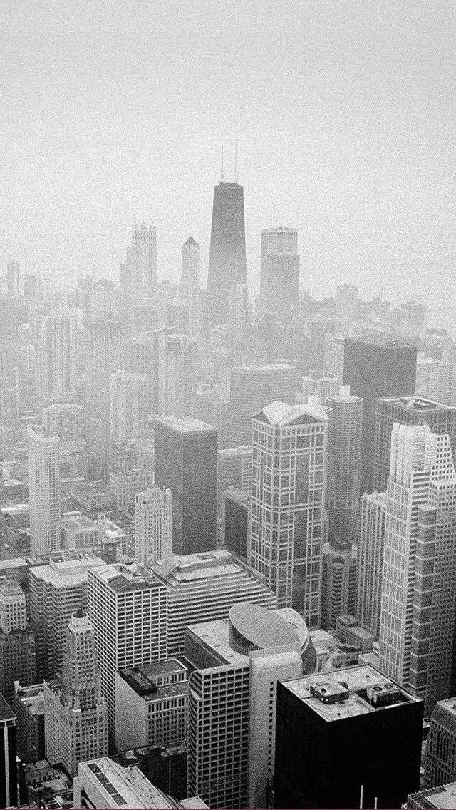 Foggy City Skyline with Tall Buildings in Grayscale