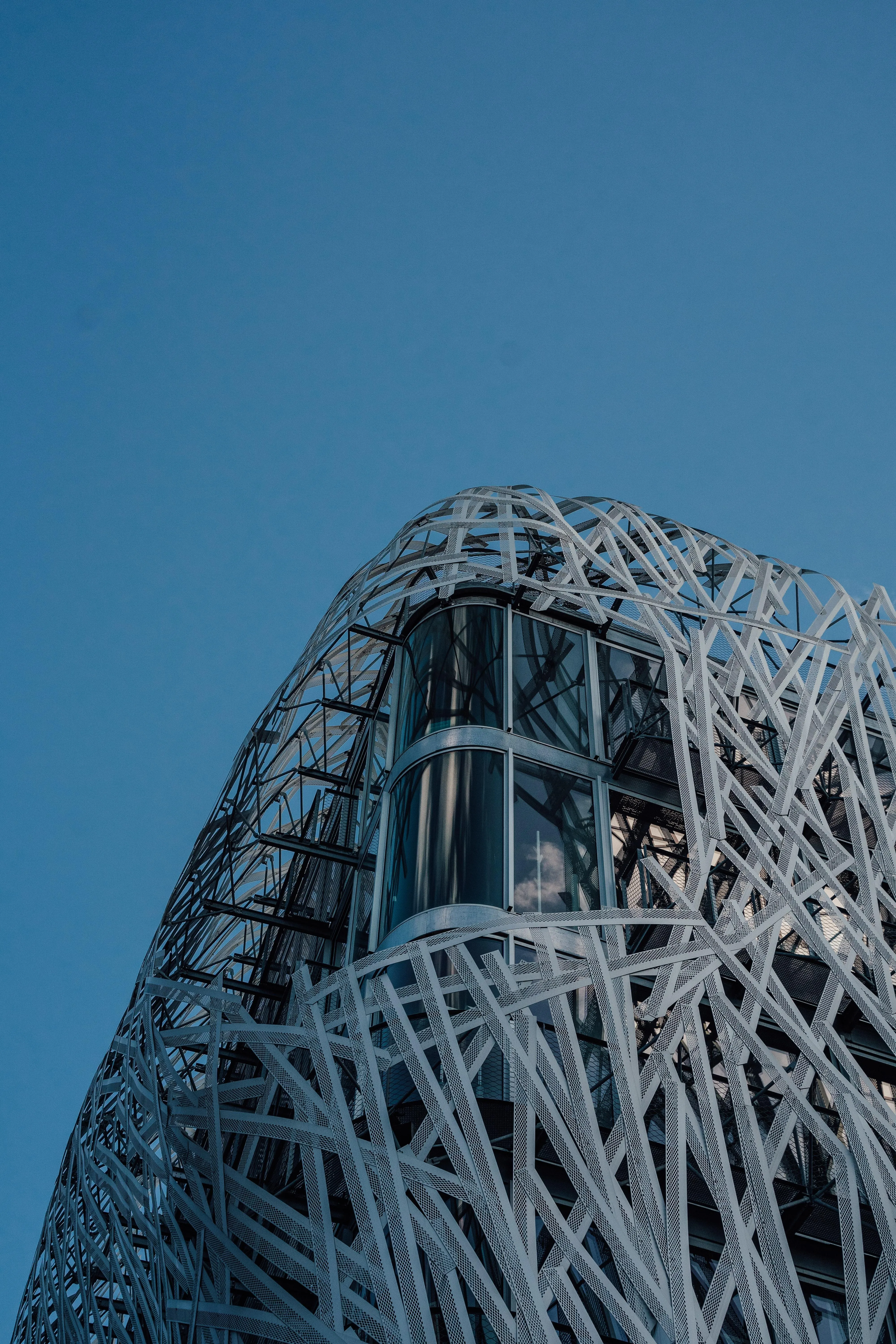 Futuristic Architecture Design with Steel Curves Wallpaper