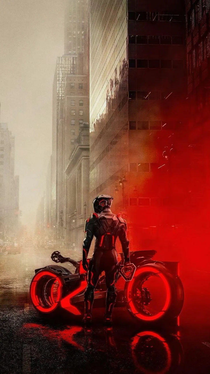 Futuristic Biker in Red Riding Through Dark City Wallpaper