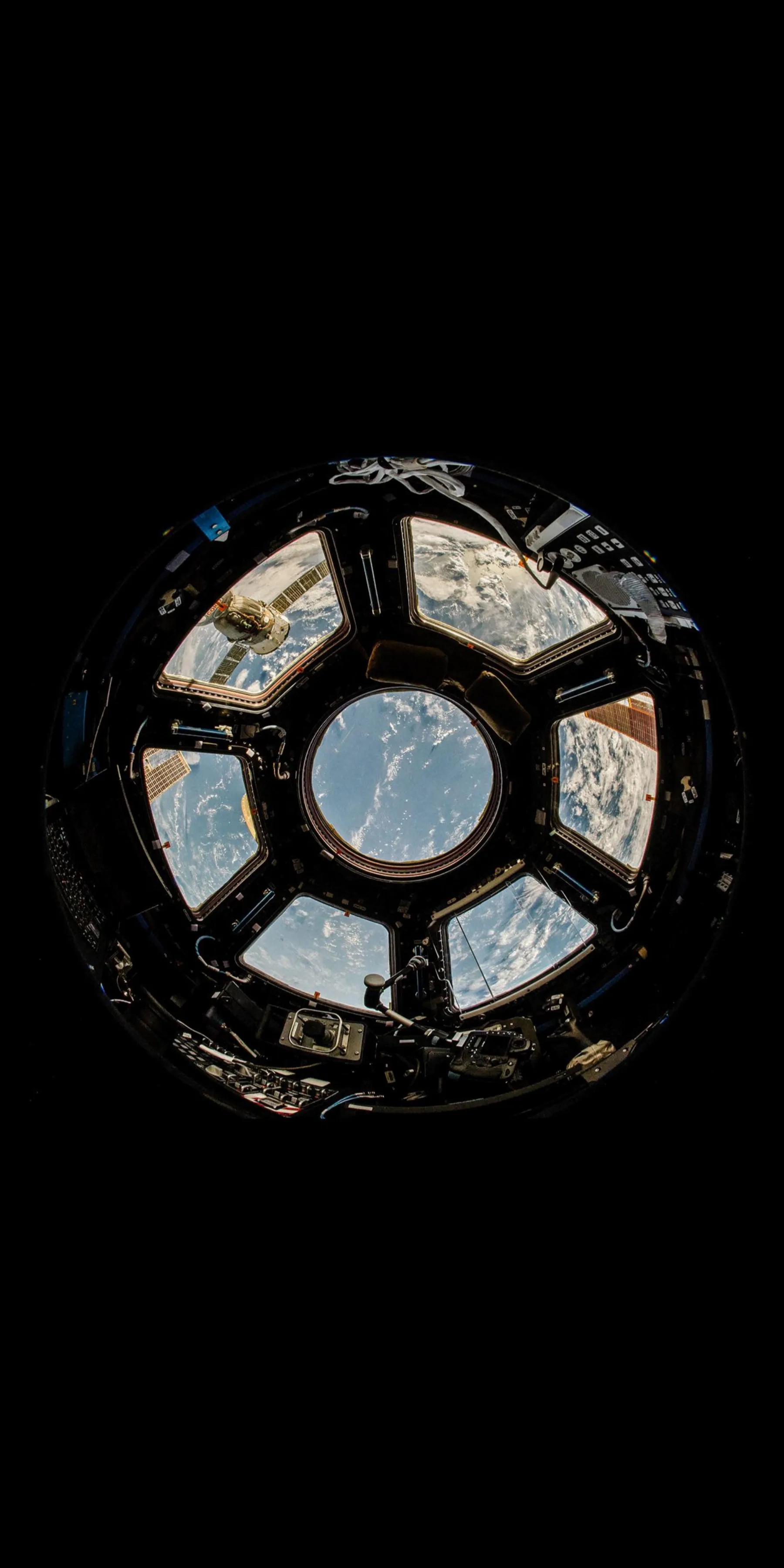 Futuristic Iron Design with Glowing Blue Center Wallpaper