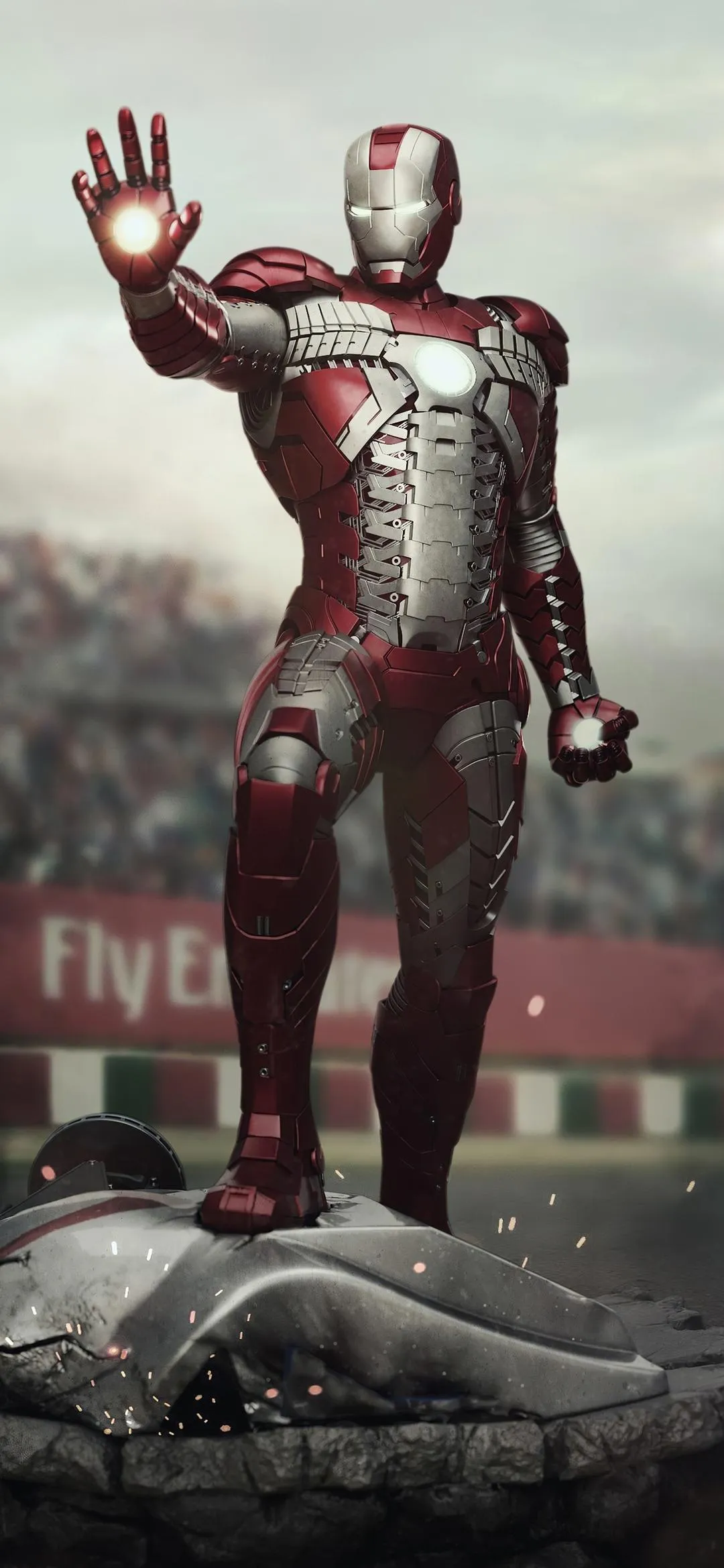 Futuristic Iron Warrior Standing in Battle Scene Wallpaper