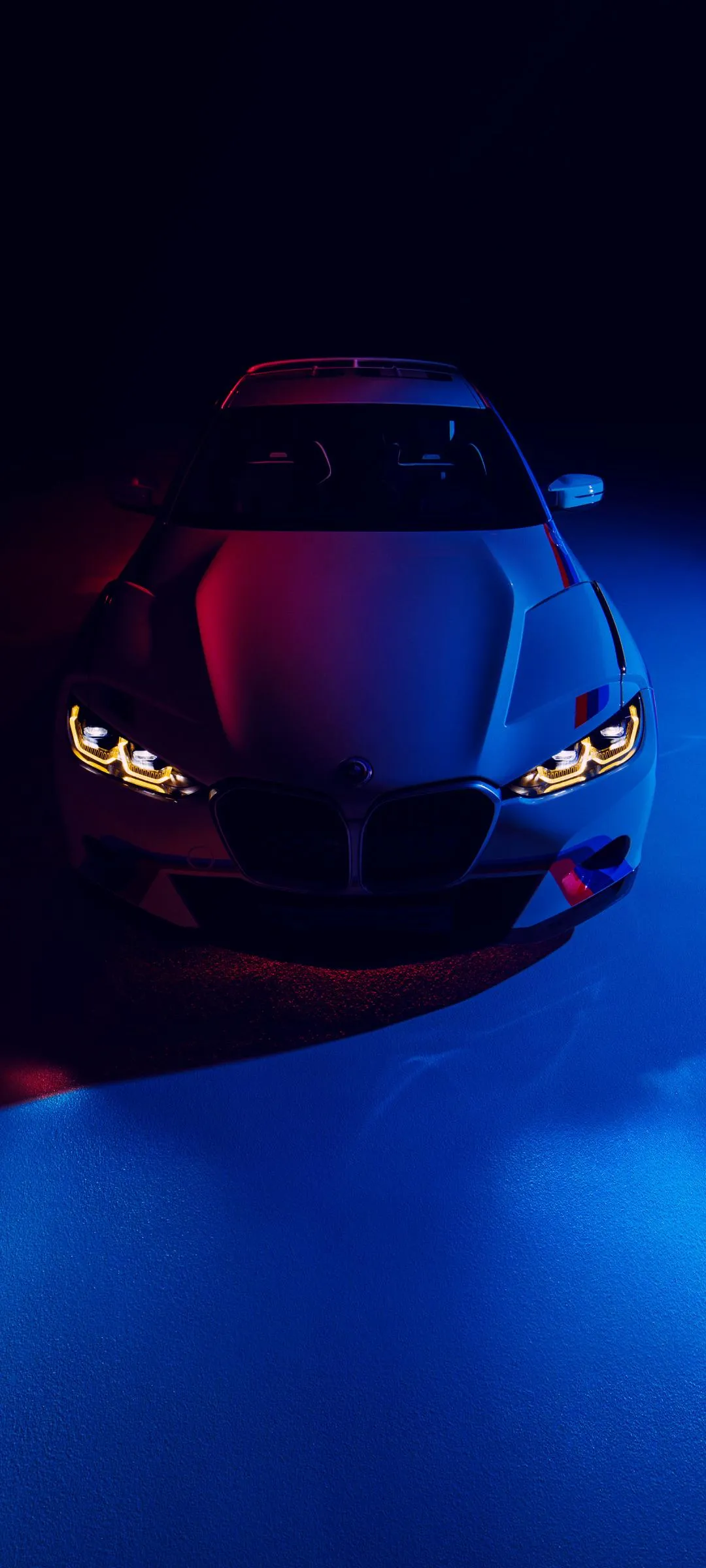 Futuristic Sports Car under Blue and Red Lights Wallpaper