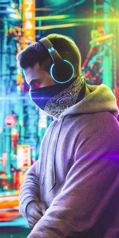 Futuristic Street DJ Wearing Headphones at Night Wallpaper
