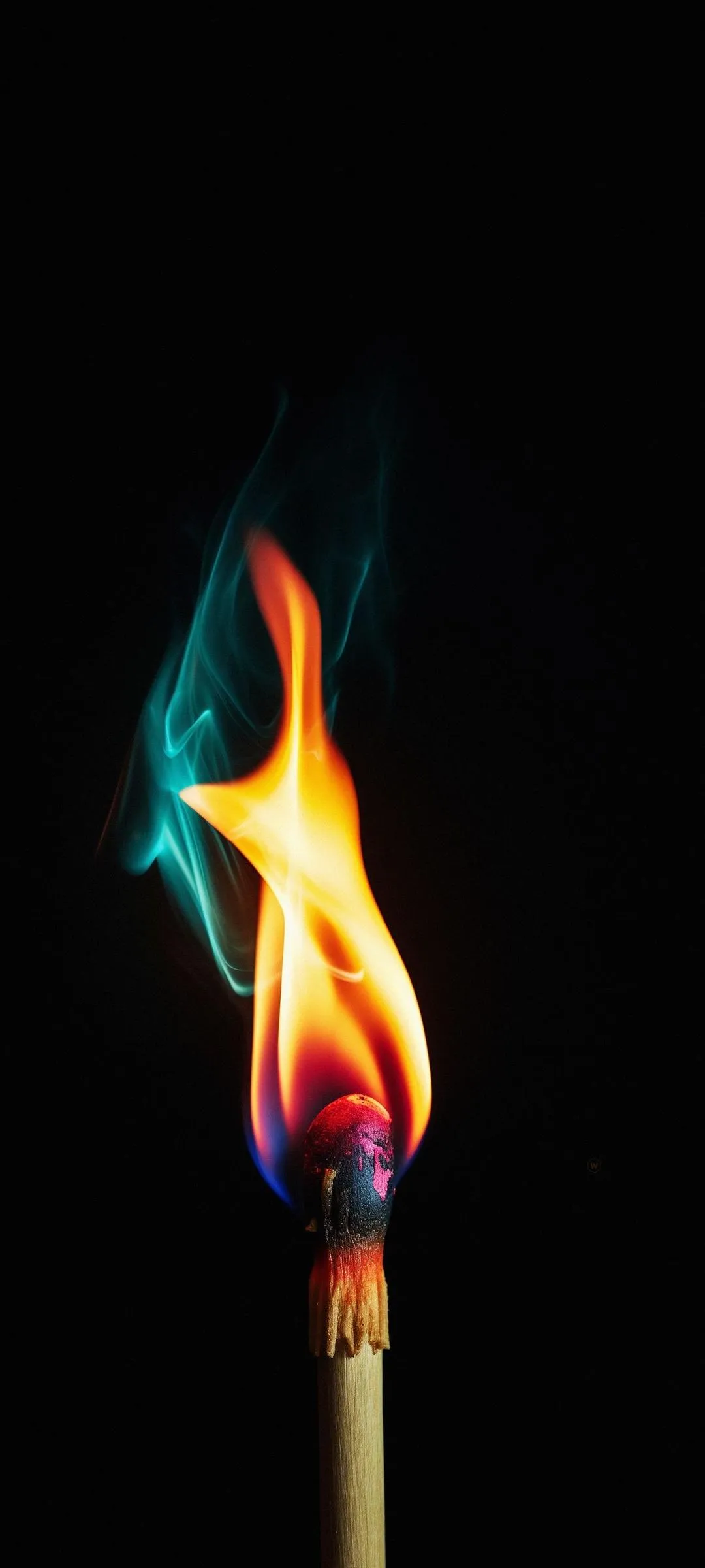 Glowing Matchstick Flame in Black Background Wallpaper