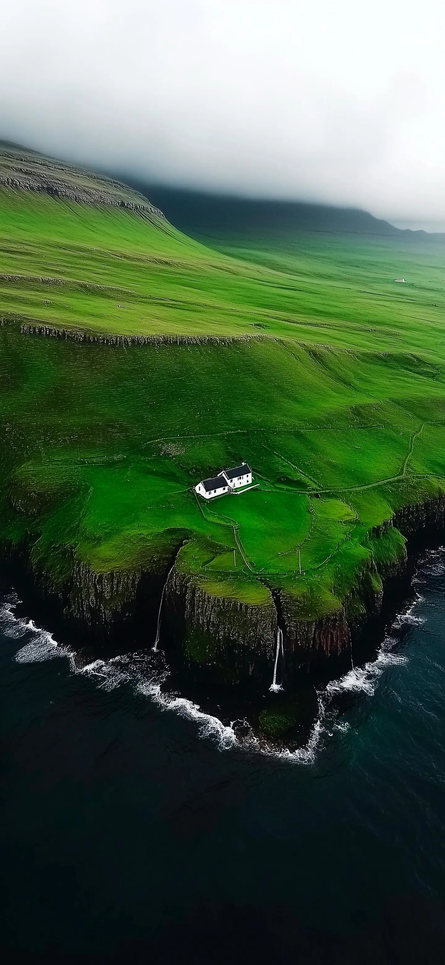 Green Cliffside Overlooking Ocean and Lush Coastal Landscape